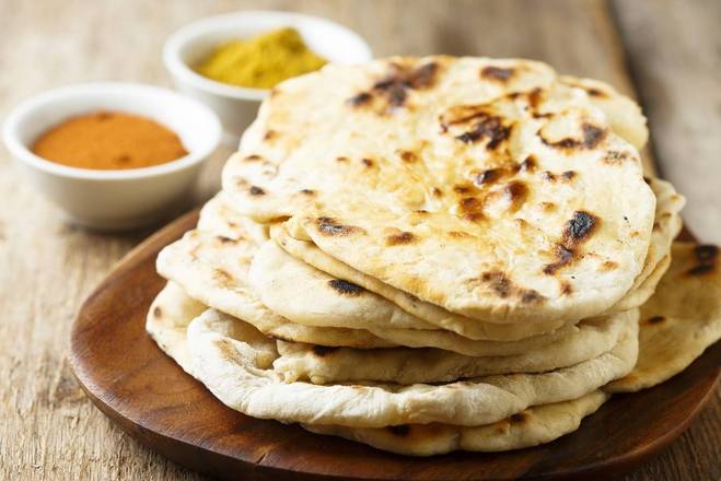 Order Plain Naan (1pc) food online from Aroma Indian Restaurant store, Bloomington on bringmethat.com