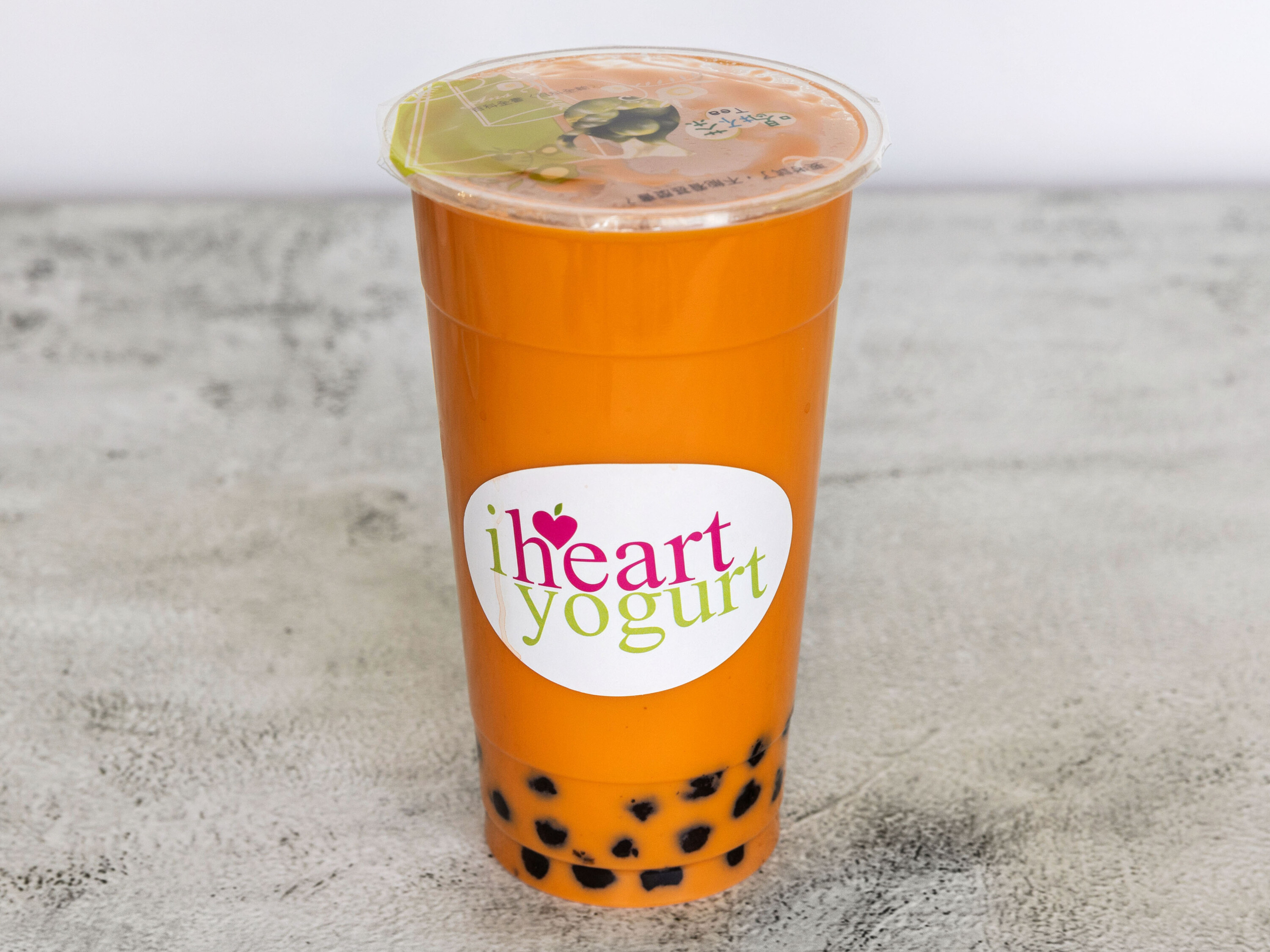 Order Thai Tea 24 OZ food online from I Heart Yogurt store, Dallas on bringmethat.com