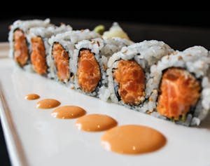 Order Spicy Salmon Roll food online from Oyama Sushi & Steakhouse store, Cedar Rapids on bringmethat.com