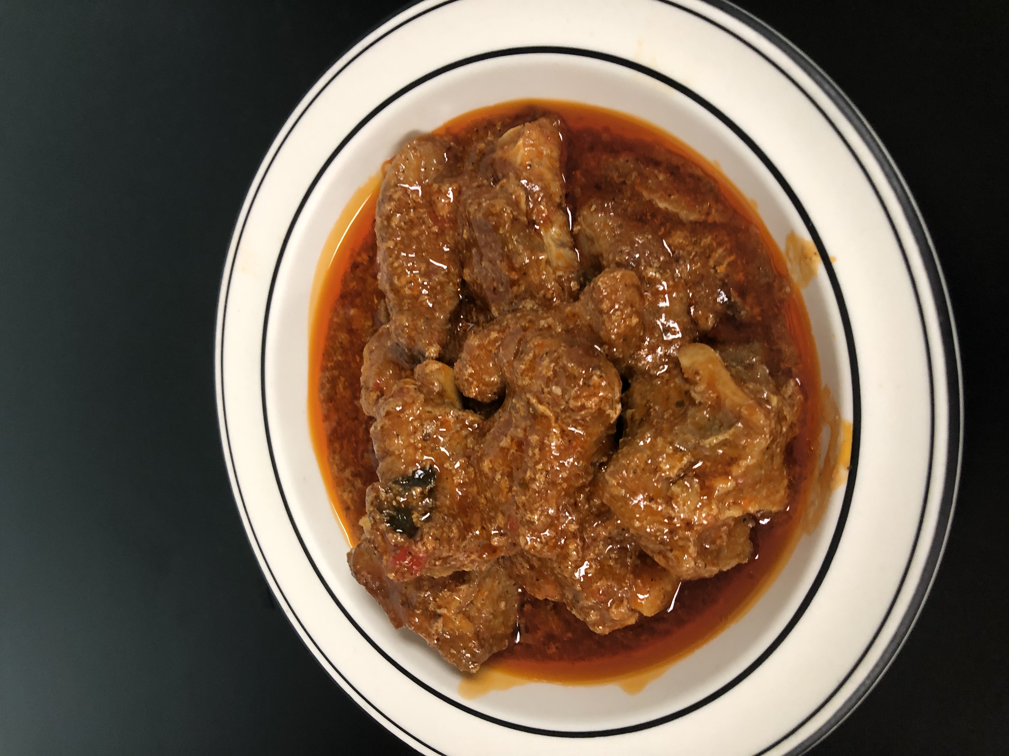 Order Pork Ribs in Sauce food online from Bani Restaurant store, Lowell on bringmethat.com