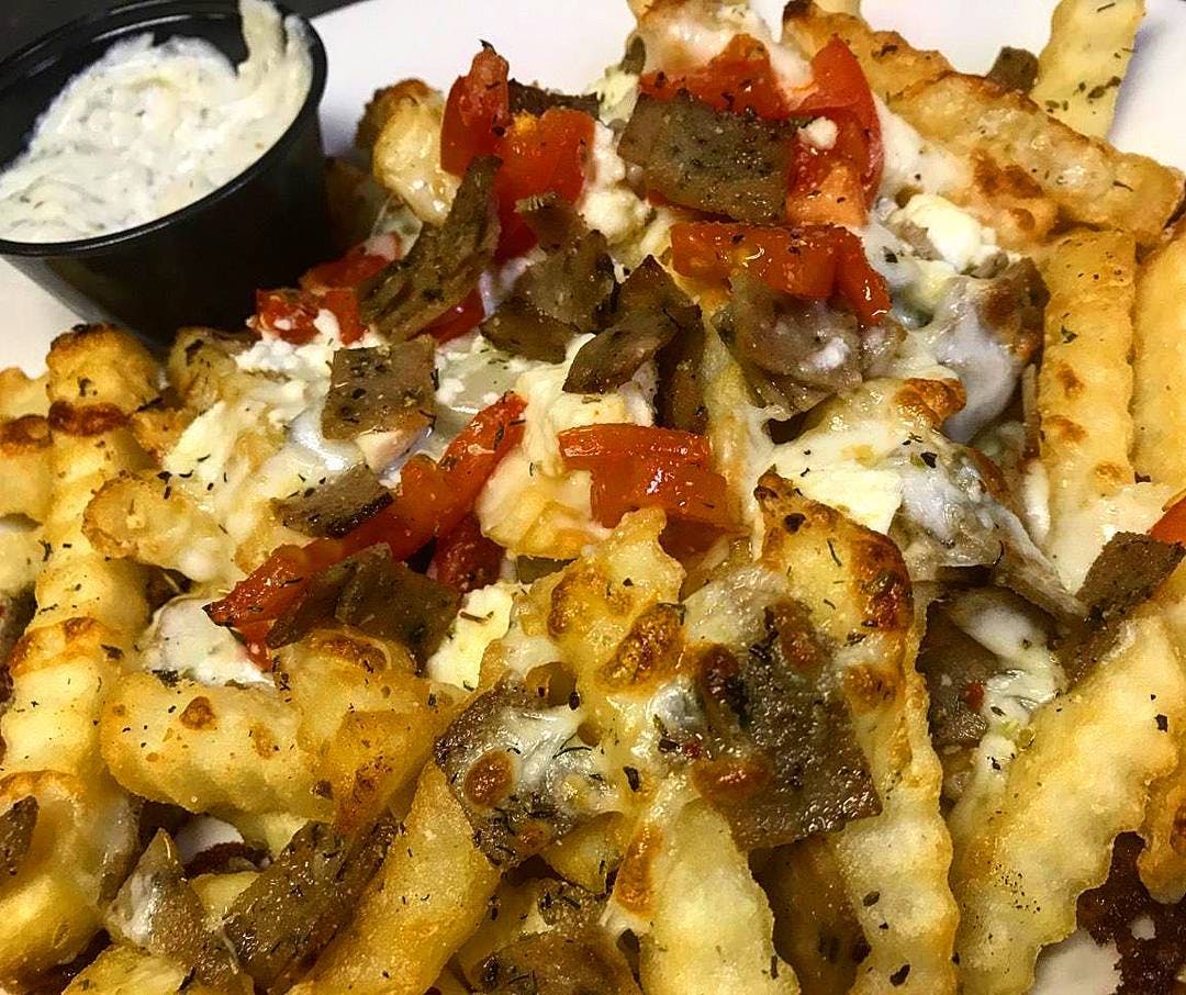 Order Greek Fries - Basket food online from Holiday Pizza store, Statesboro on bringmethat.com