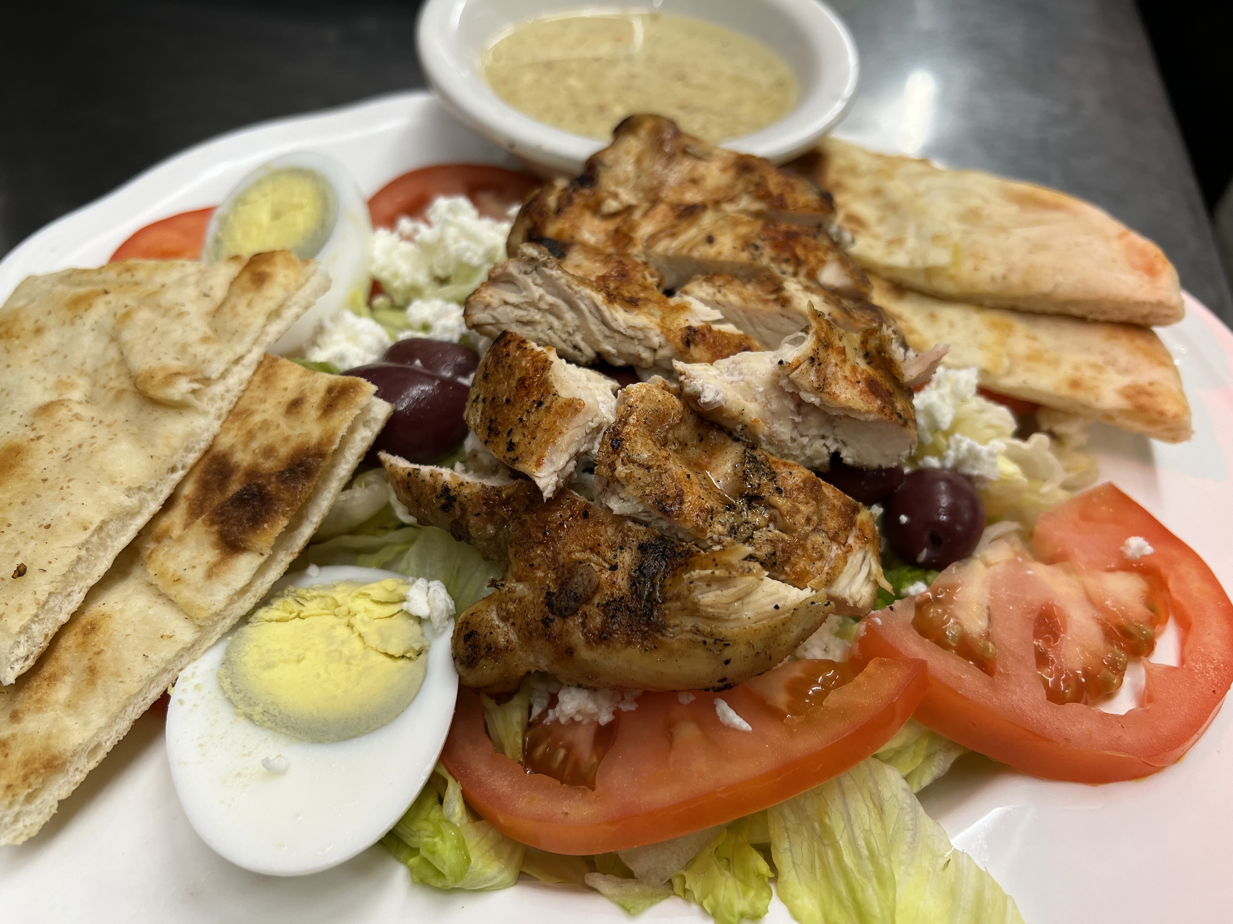 Order Greek Salad with Chicken Breast food online from Eastridge Family Restaurant store, Rochester on bringmethat.com