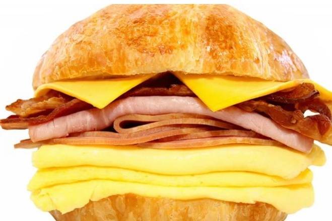 Order 83. Ham, Bacon, Egg, and Cheese Sandwich on a Croissant food online from Lee Sandwiches store, San Jose on bringmethat.com