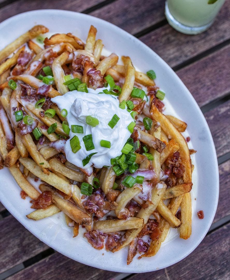 Order Loaded Fries - Regular food online from Chow Pizza Bar store, Raleigh on bringmethat.com