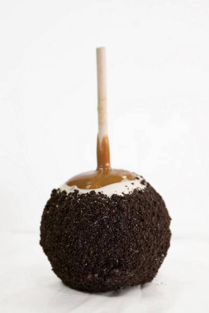 Order Cookie 'n Cream Caramel Apple food online from Rocky Mountain Chocolate Factory store, Iowa City on bringmethat.com