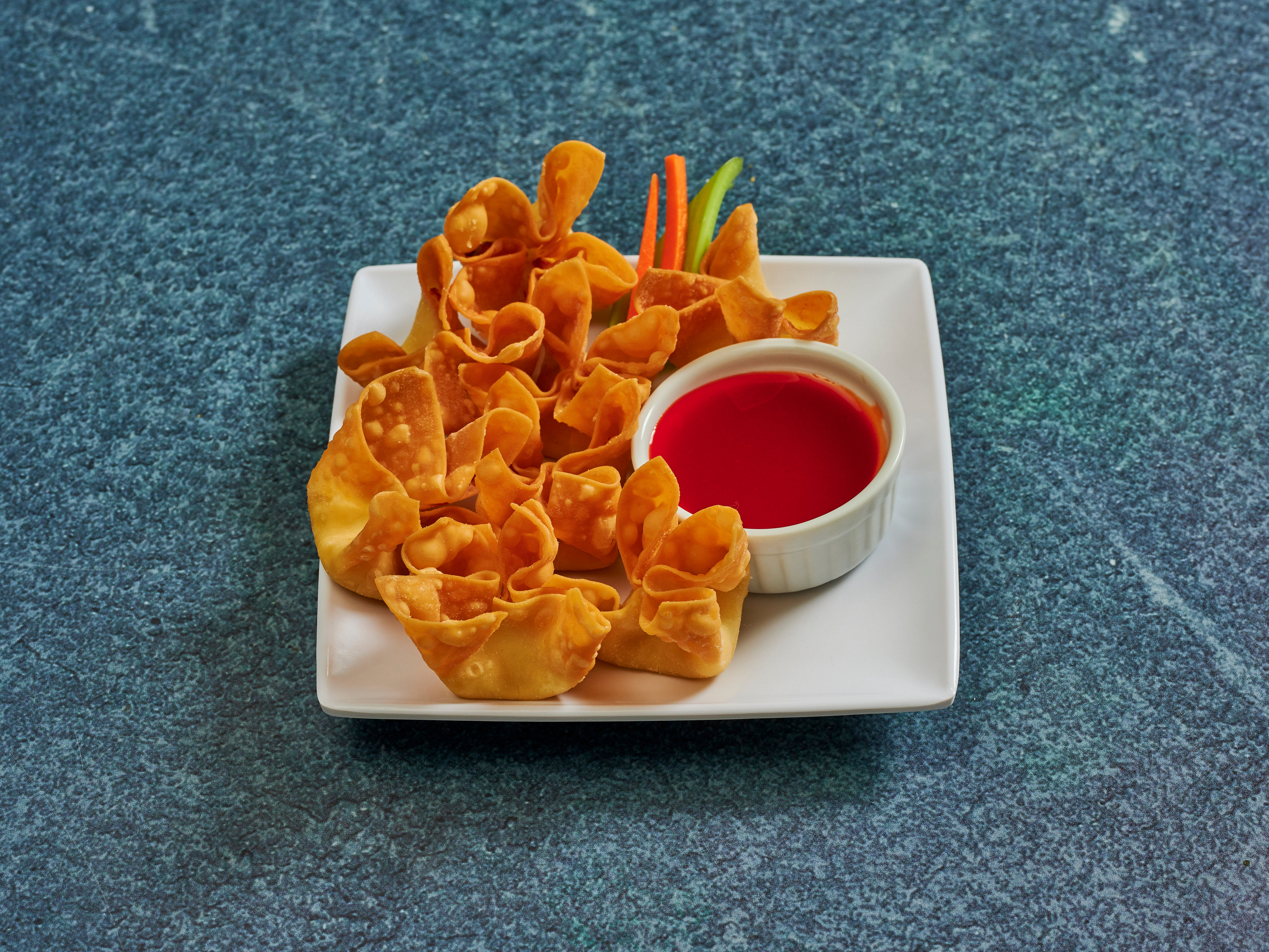 Order 8 Crab Puffs food online from Golden Dragon Chinese Restaurants store, Tucson on bringmethat.com