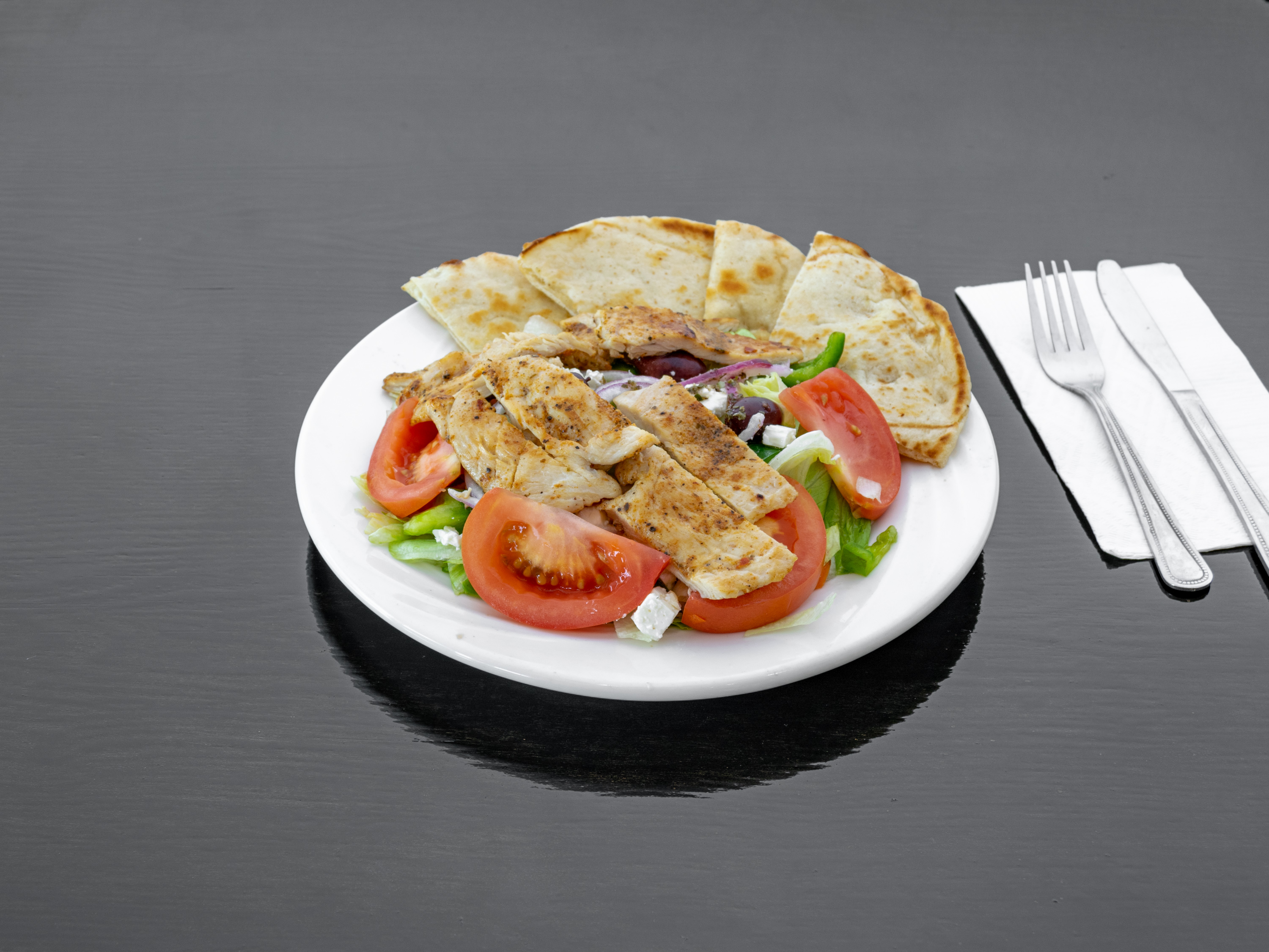 Order Tri Color Greek Salad in a Tortilla Shell food online from Don's Diner store, Irvington on bringmethat.com