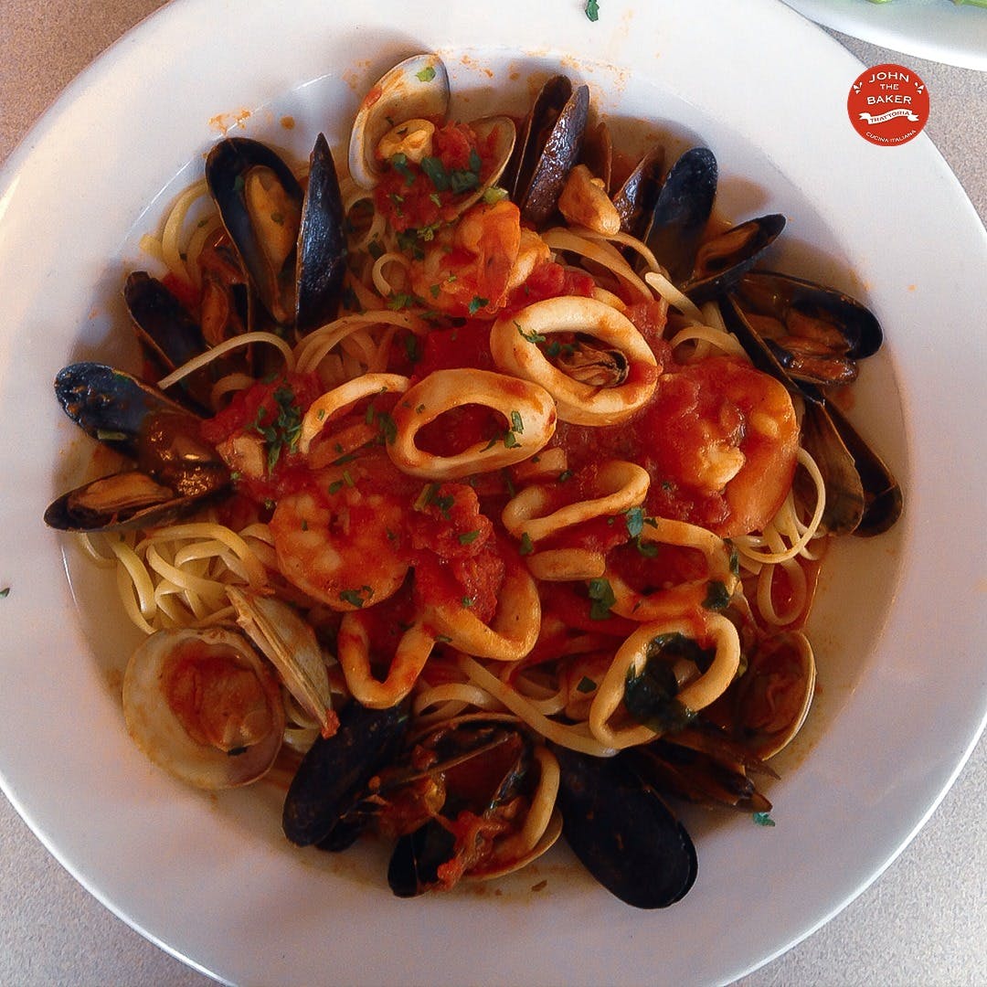 Order Zuppa di Pesce over Linguine - Entree food online from John The Baker store, Stamford on bringmethat.com
