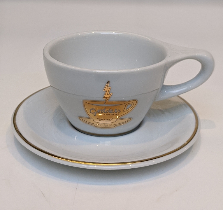 Order Not Neutral Cup/Saucer (fancygold) food online from Goddess And The Baker store, Chicago on bringmethat.com