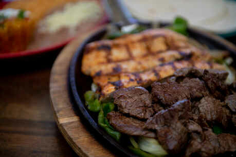 Order Chicken & Steak Fajitas food online from Frontera Mex-Mex Grill store, Suwanee on bringmethat.com