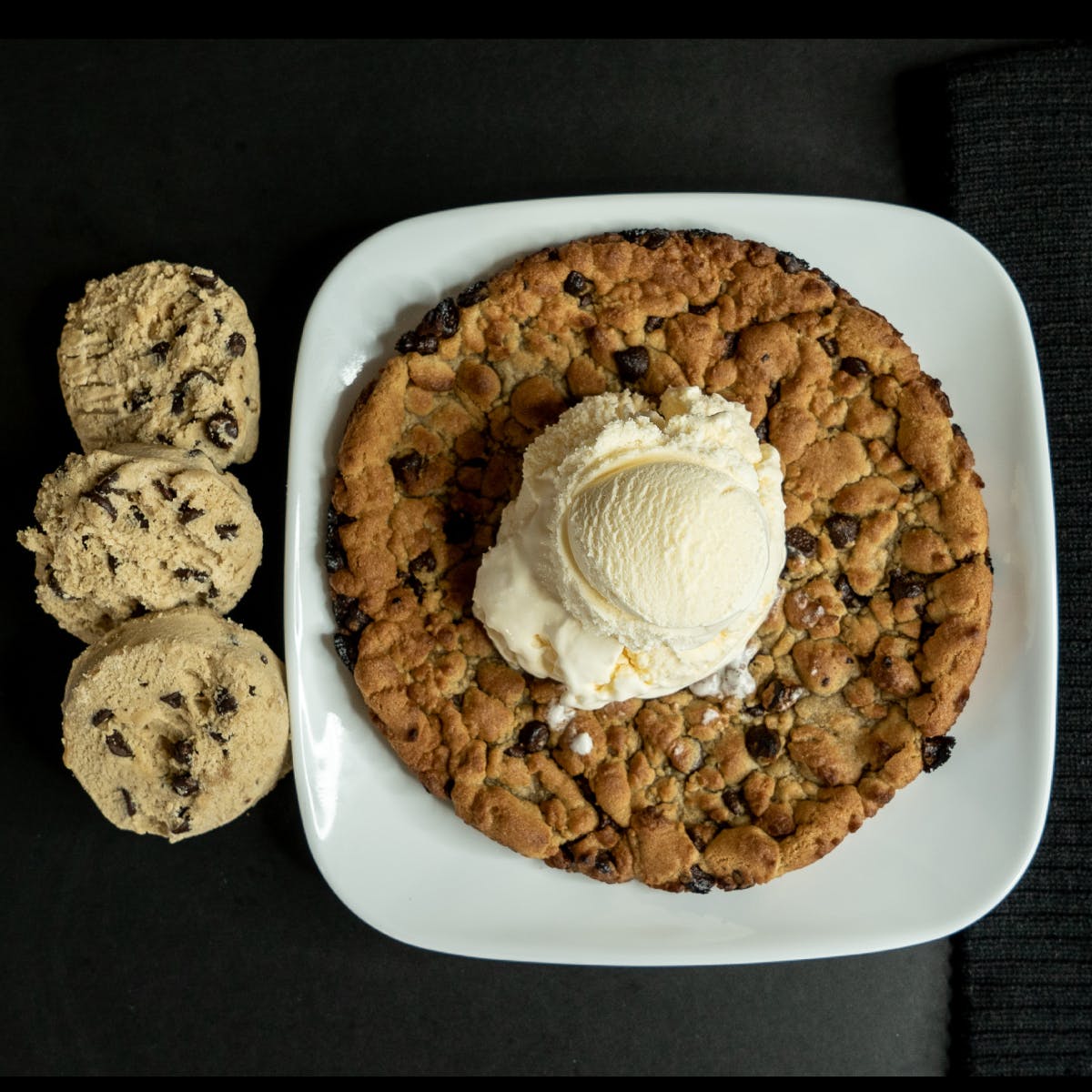 Order Chocolate Chip Cookie with Vanilla Ice Cream - Giant 9" food online from Tenney's Pizza store, Saratoga Springs on bringmethat.com