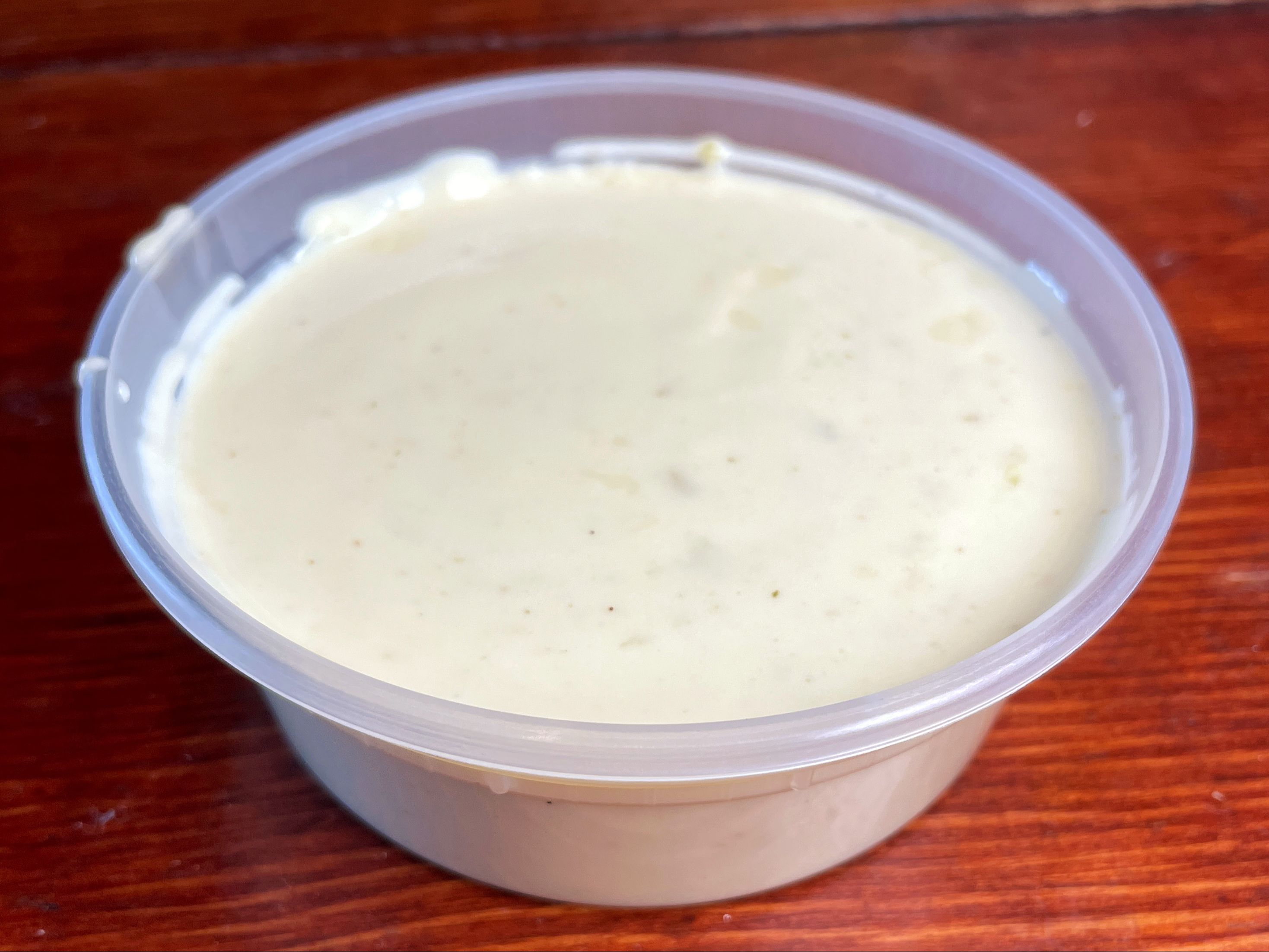 Order 16 oz. Queso food online from Right Coast Taqueria store, Deer Park on bringmethat.com