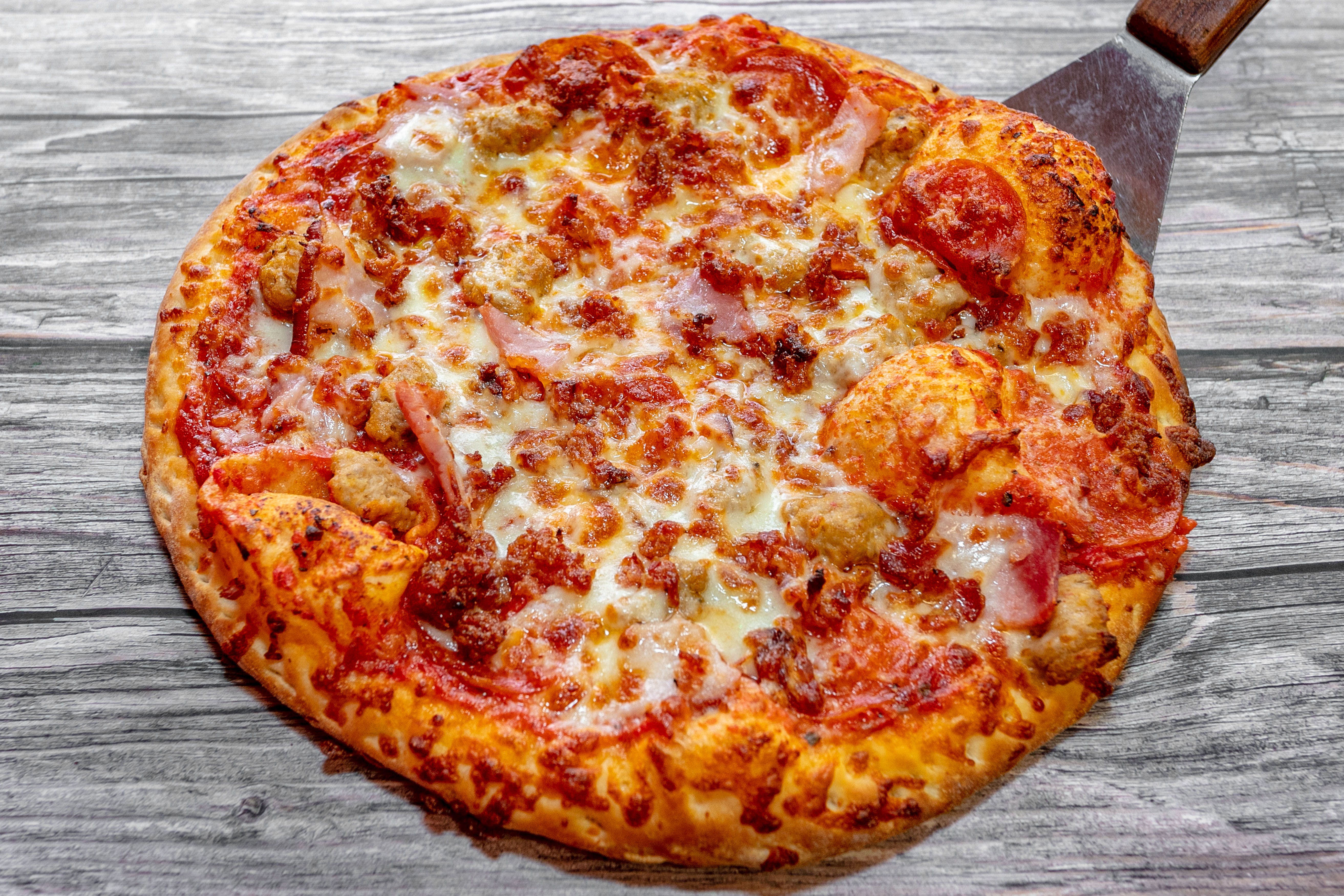 Order Meat Lovers Pizza - X-Large 16" food online from Pizza Place store, Adairsville on bringmethat.com