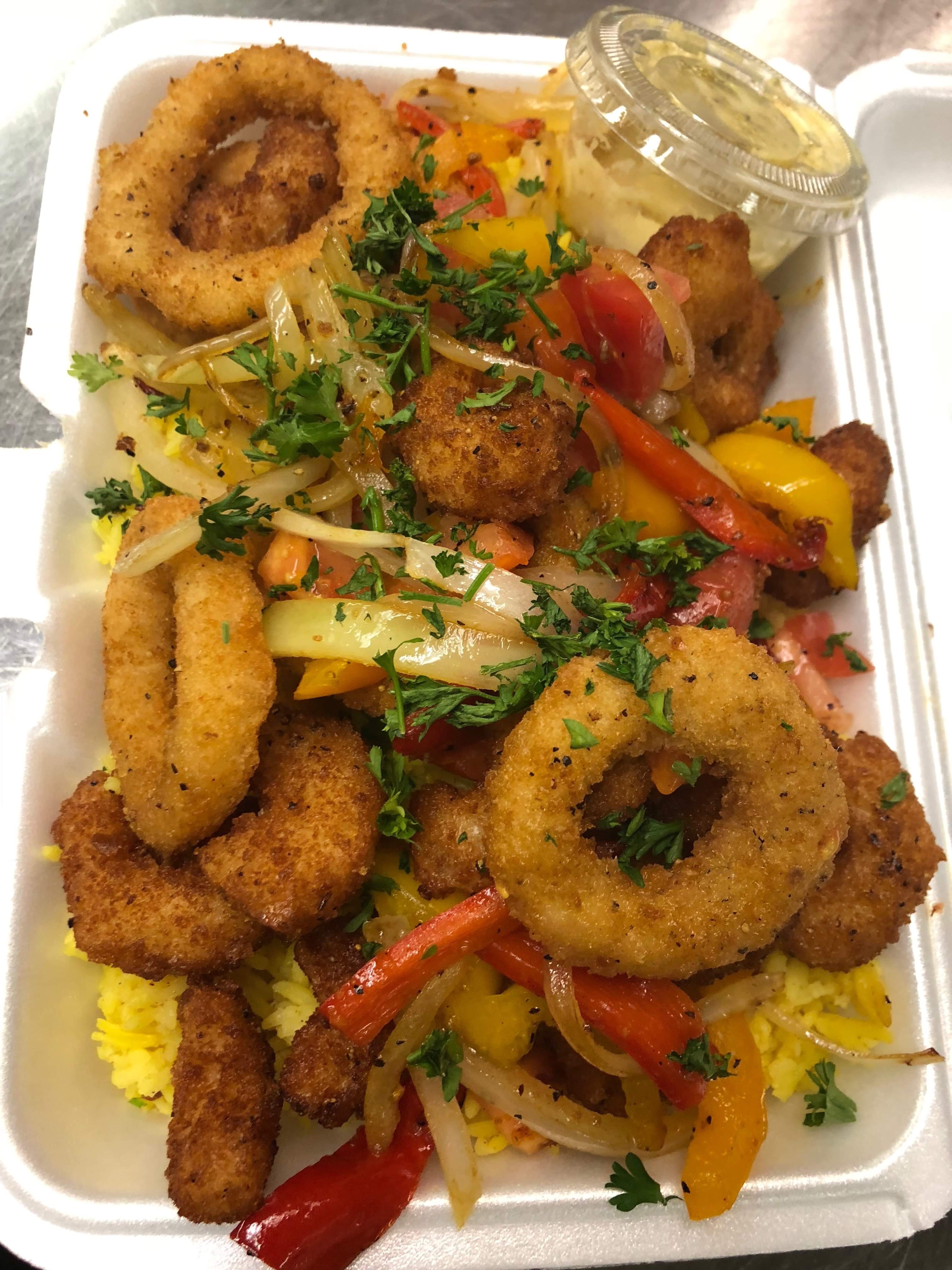 Order Fried Calamari over yellow Rice food online from Lolo Potluck store, Troy on bringmethat.com
