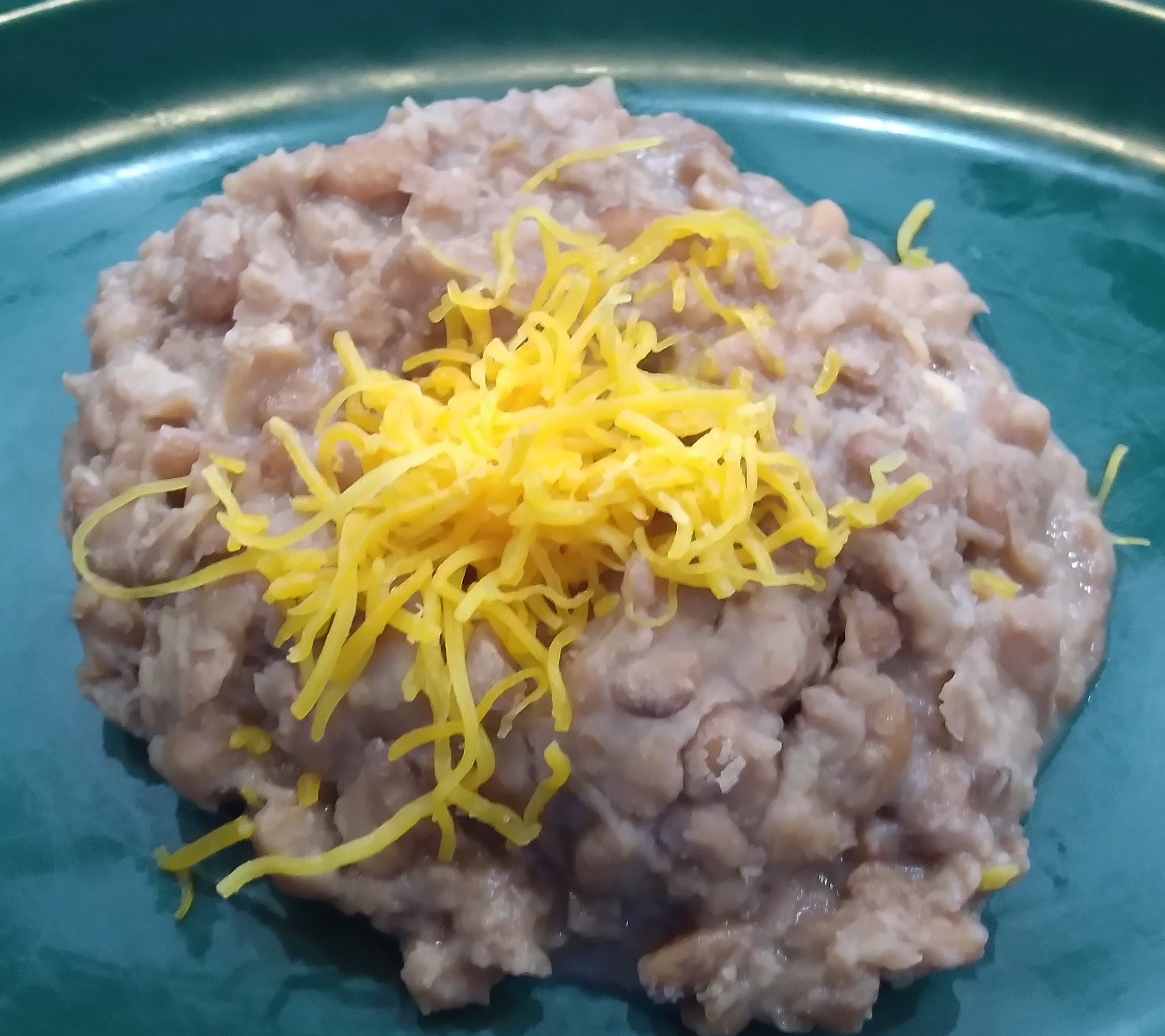 Order Side Refried Beans food online from Talitas Southwest Cafe store, Columbus on bringmethat.com