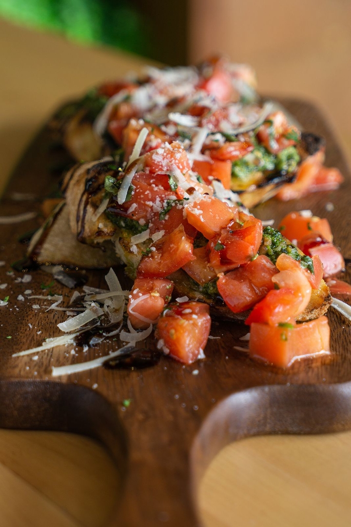 Order Tomato Bruschetta (V) food online from Blue Water Grill store, Grand Rapids on bringmethat.com