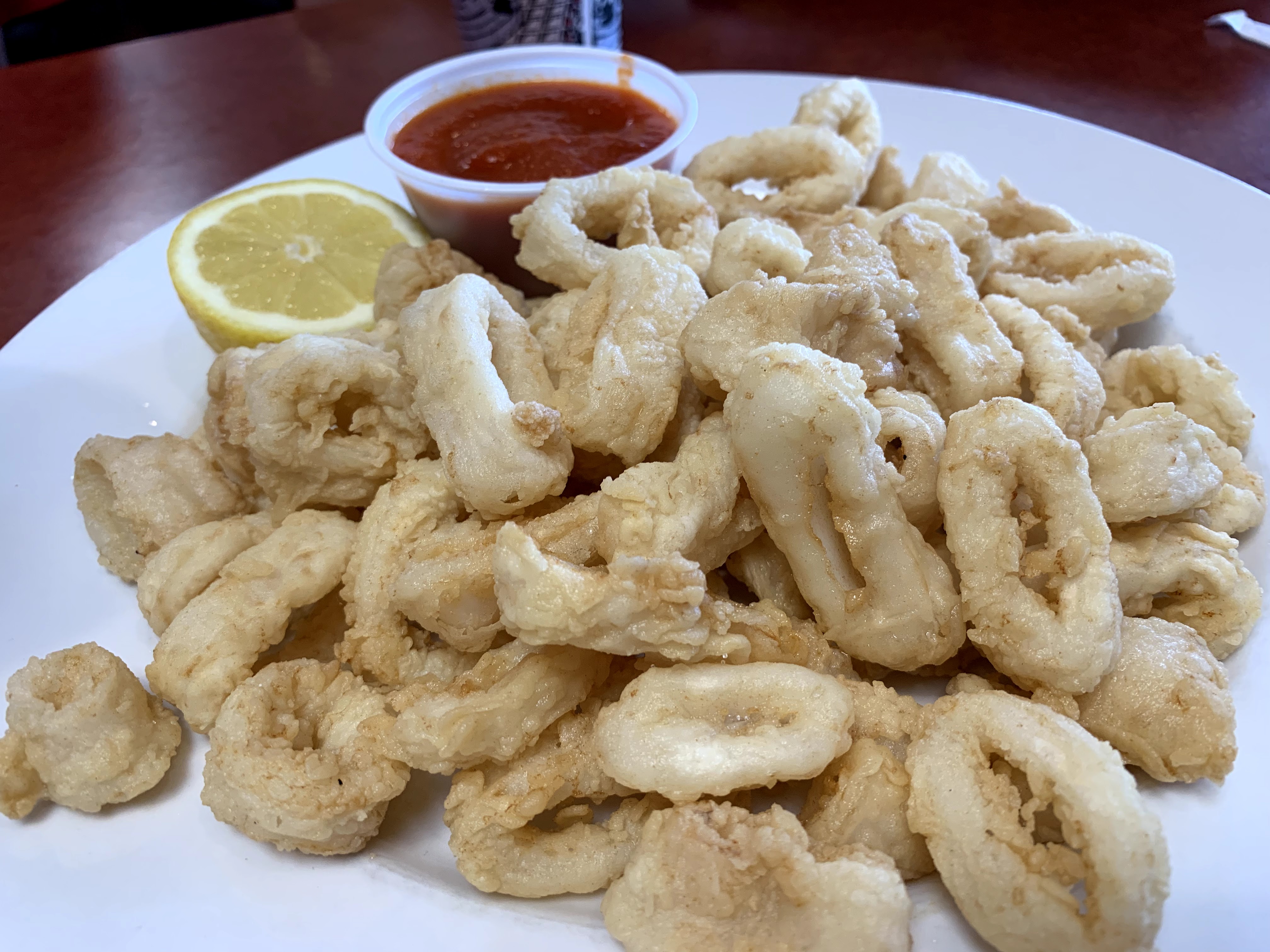 Order Fried Calamari food online from Due Amici Pizza store, Charlotte on bringmethat.com