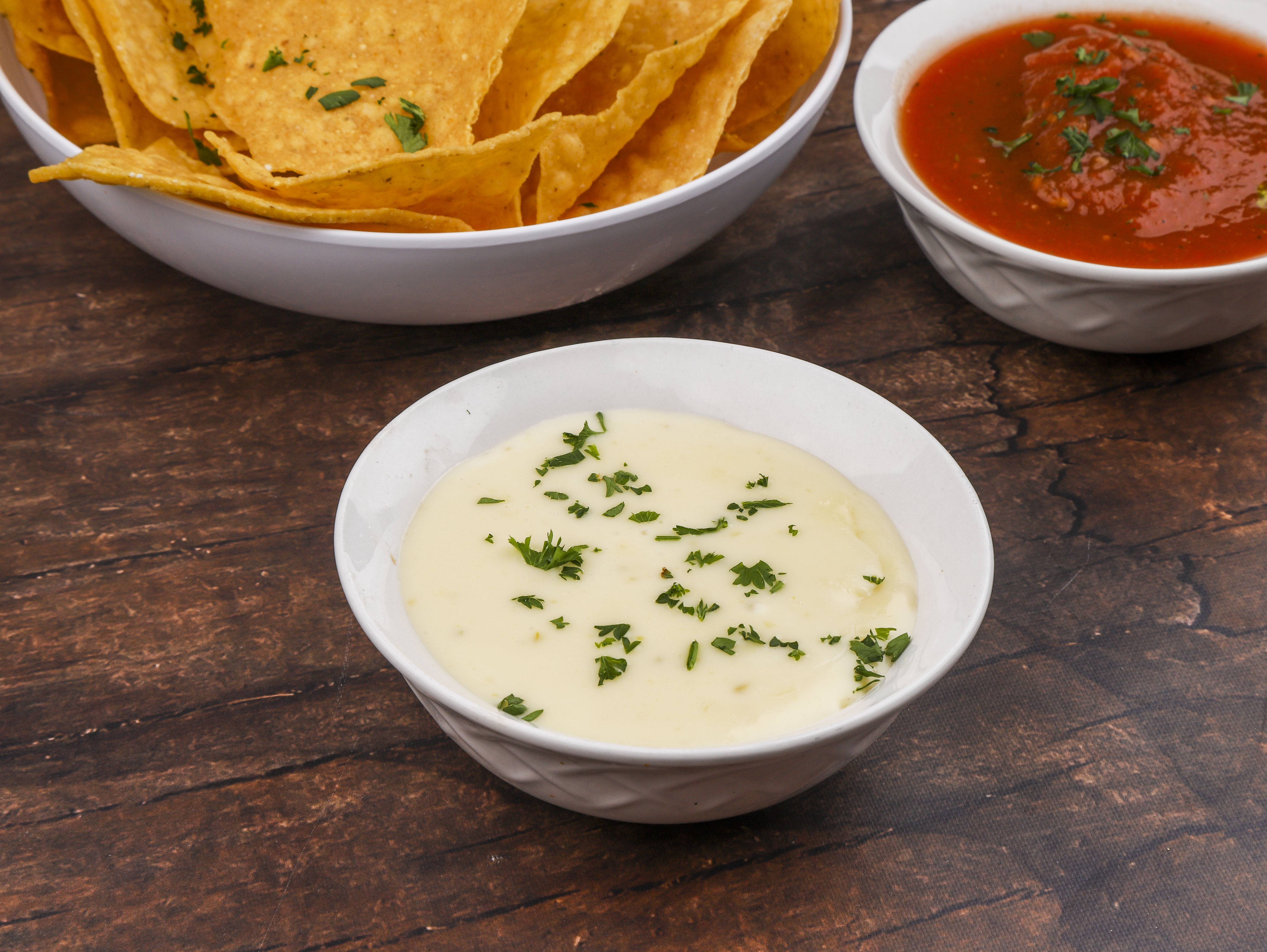 Order Queso Dip food online from San Marcos Mexican Restaurant store, Burlington on bringmethat.com