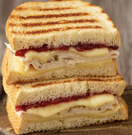 Order Turkey Cranberry Grilled Cheese food online from Atlanta Bread Company store, Gainesville on bringmethat.com