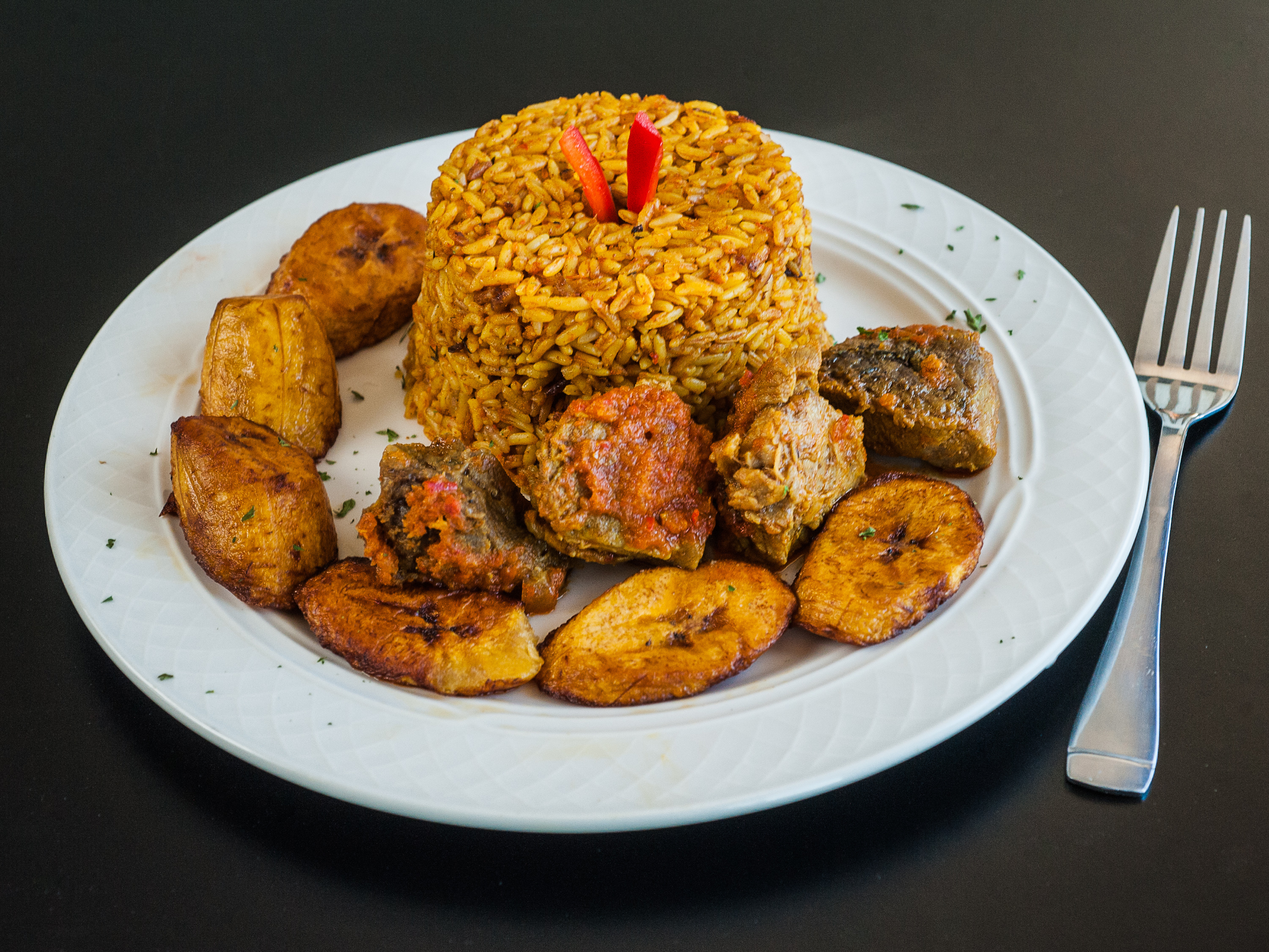 Order Jollof Rice, Plantains and Beef Dinner food online from Spice Bistro store, Atlanta on bringmethat.com