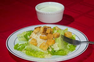 Order Caesar Salad food online from Papa Ray's Pizza - Miriam St. store, Daly City on bringmethat.com
