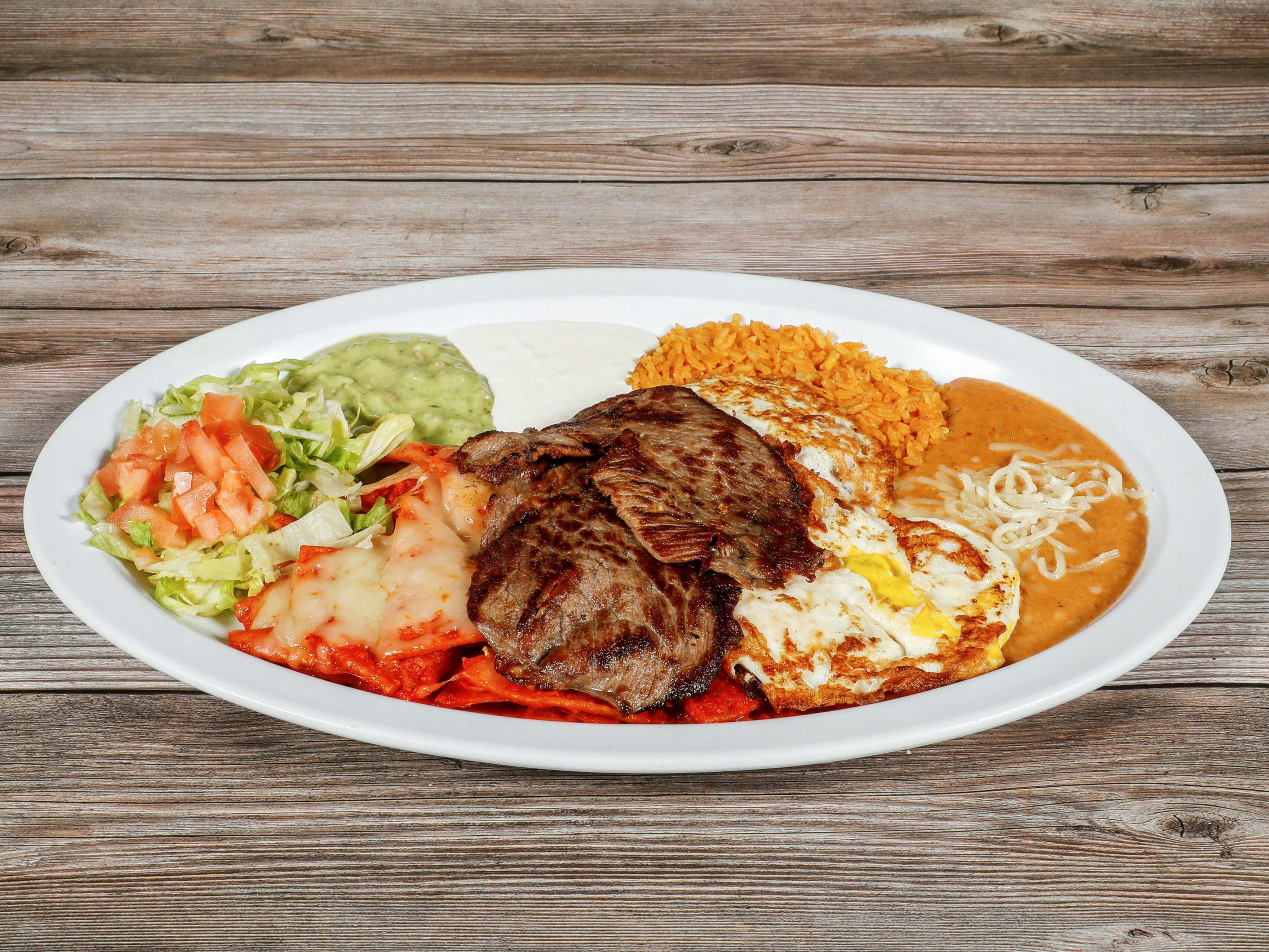 Order Chilaquiles Breakfast Plate food online from La Perla Taqueria Mexican Grill store, Chico on bringmethat.com