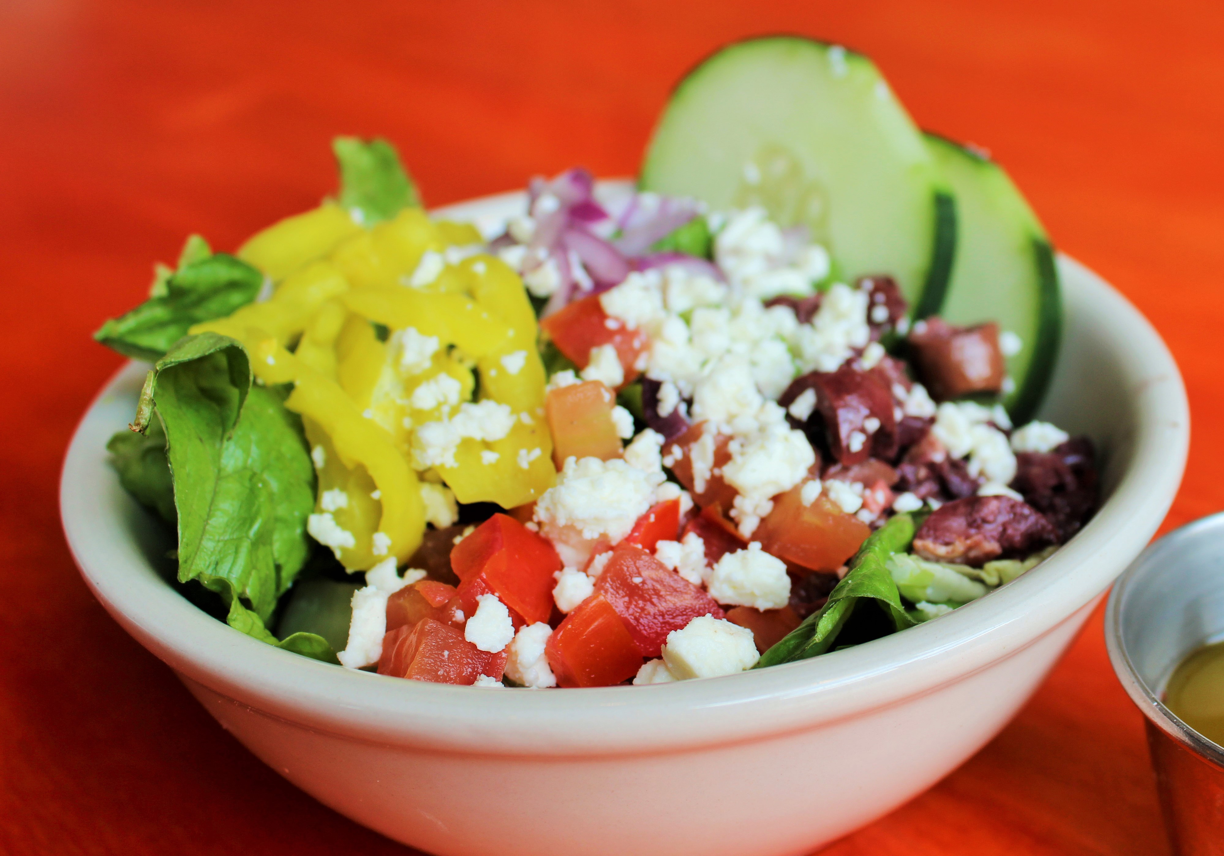 Order Greek Salad food online from The Roman Candle Pizzeria store, Middleton on bringmethat.com