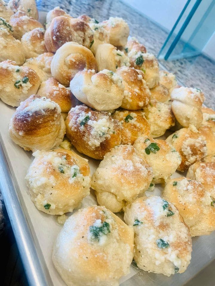 Order Garlic Knots with Sauce - 6 Pieces food online from J & S Pizza store, South Amboy on bringmethat.com