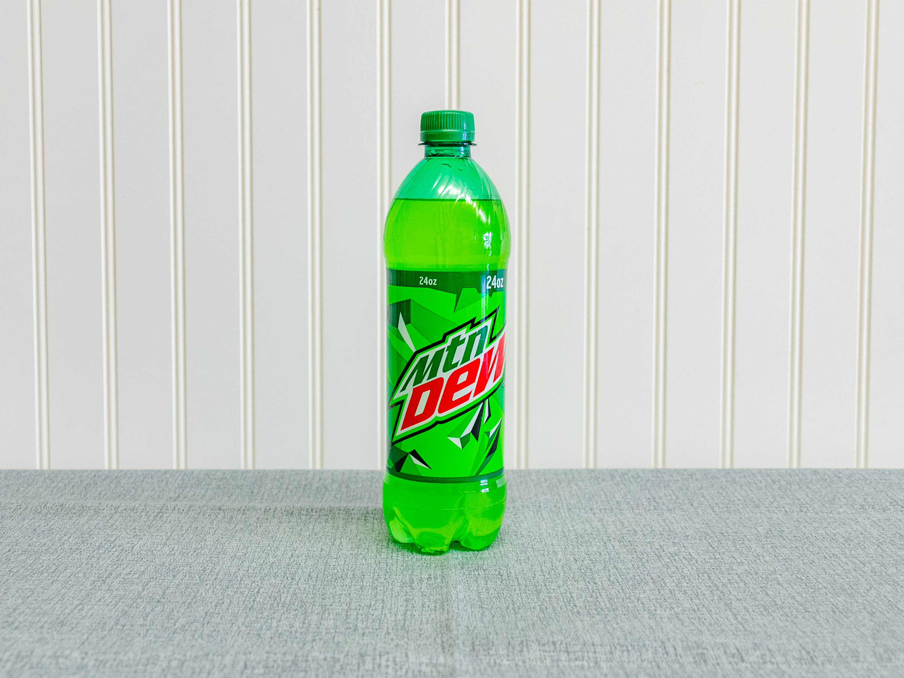 Order 24 oz. Mountain Dew food online from Just Dash It store, Englewood on bringmethat.com