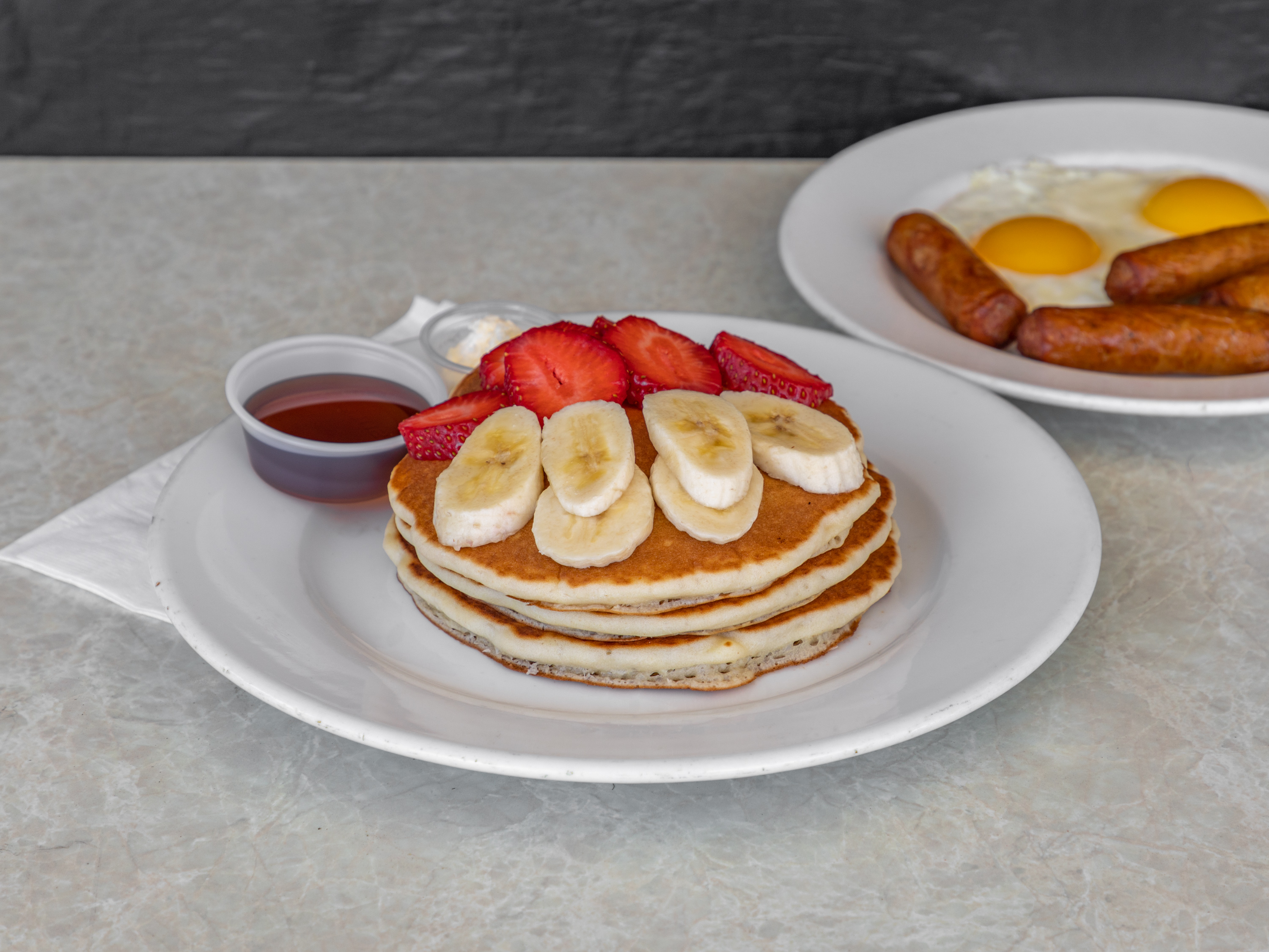 Order Pancake Combo with Link Sausage food online from Puerto Nuevo Restaurant store, Los Angeles on bringmethat.com