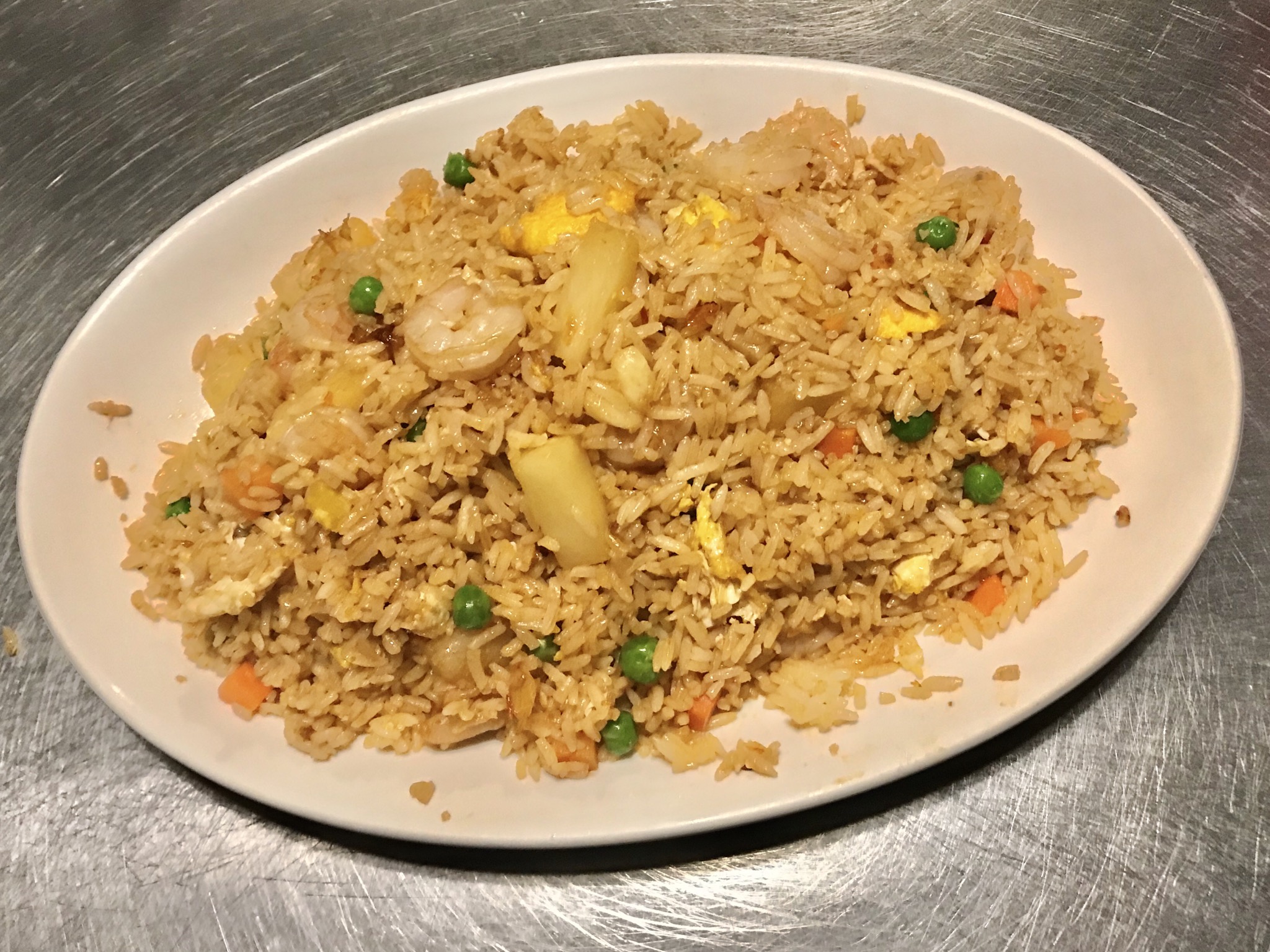 Order Indonesian Spicy Fried Rice with Shrimp and Pineapple food online from Genghis Khan Restaurant store, Seattle on bringmethat.com