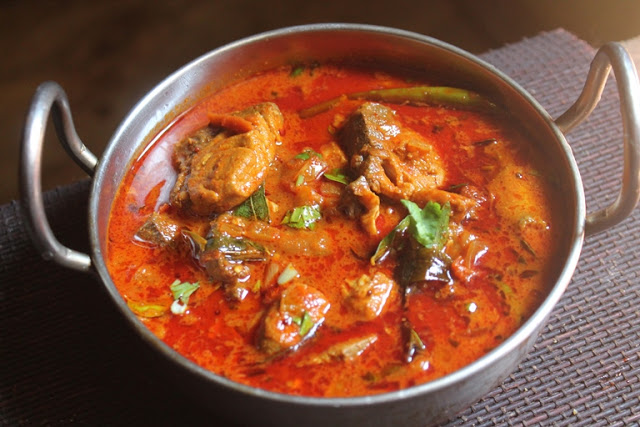 Order Madrash Fish Curry food online from Madras Cafe store, San Diego on bringmethat.com