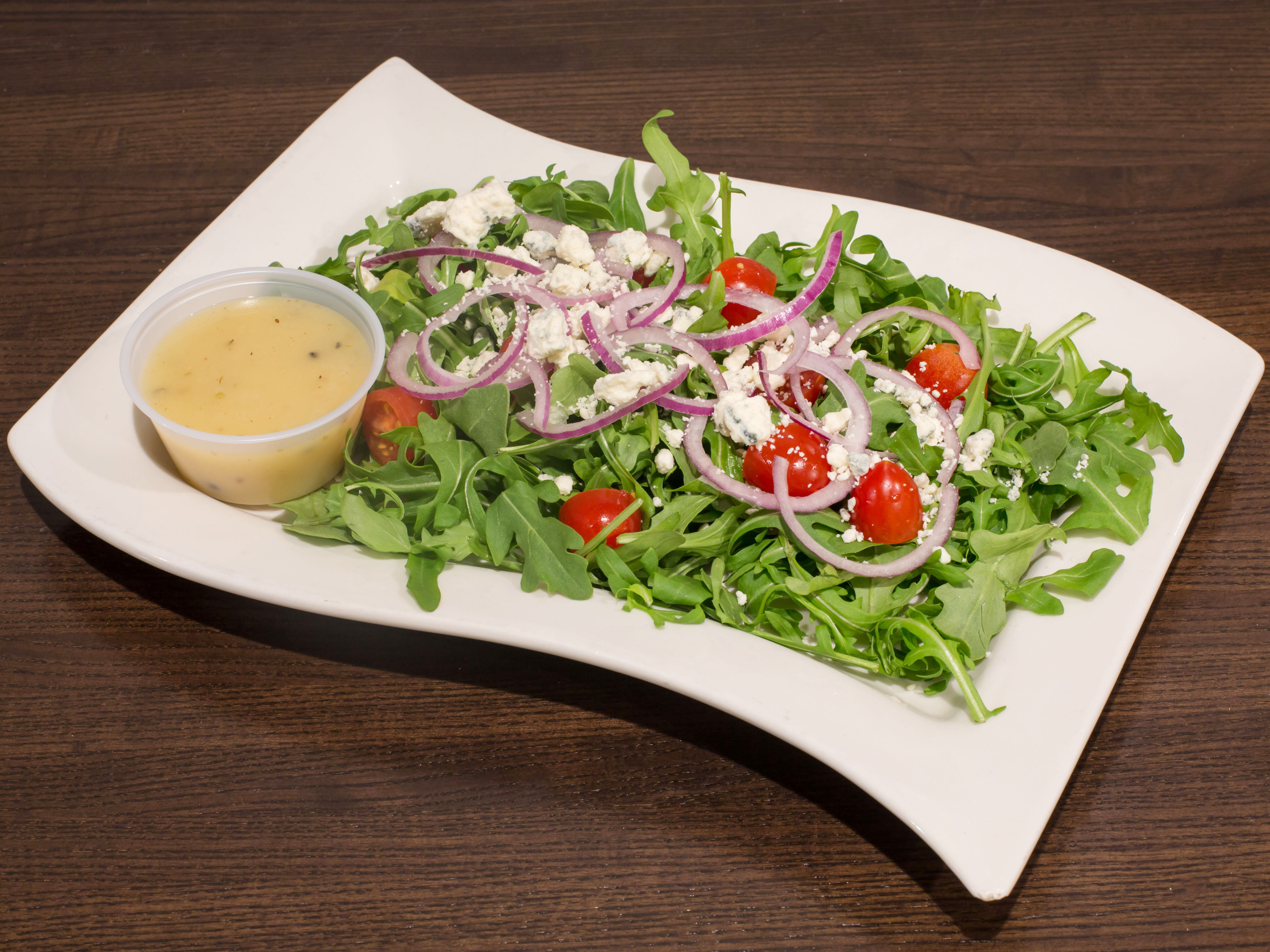 Order Arugula Salad food online from Nino's Pizza & Restaurant store, Hillsdale on bringmethat.com