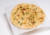 Order Garlic Naan food online from Taste Of India Grill store, Bountiful on bringmethat.com