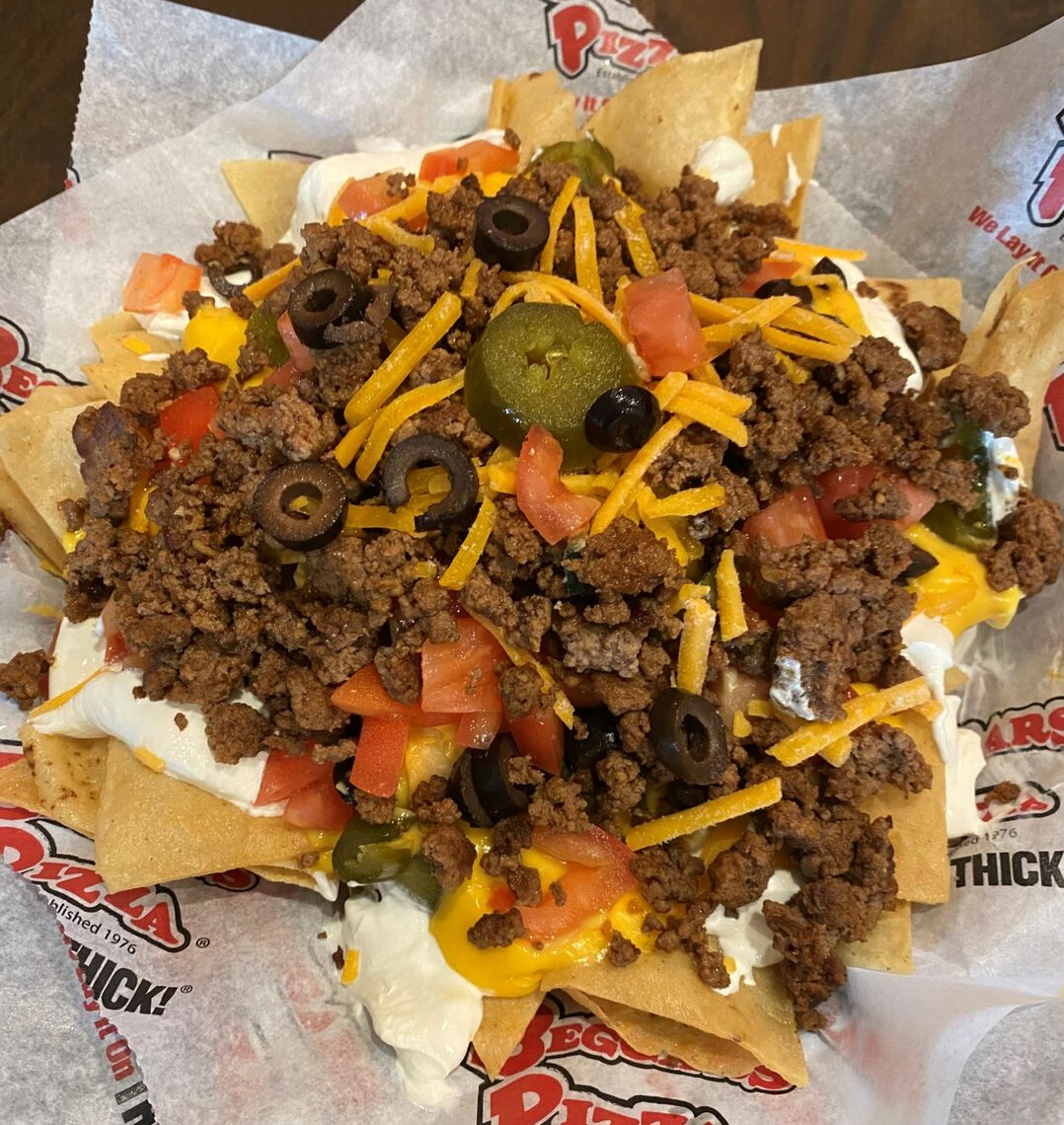 Order Loaded Nachos food online from Beggars Pizza store, Gary on bringmethat.com