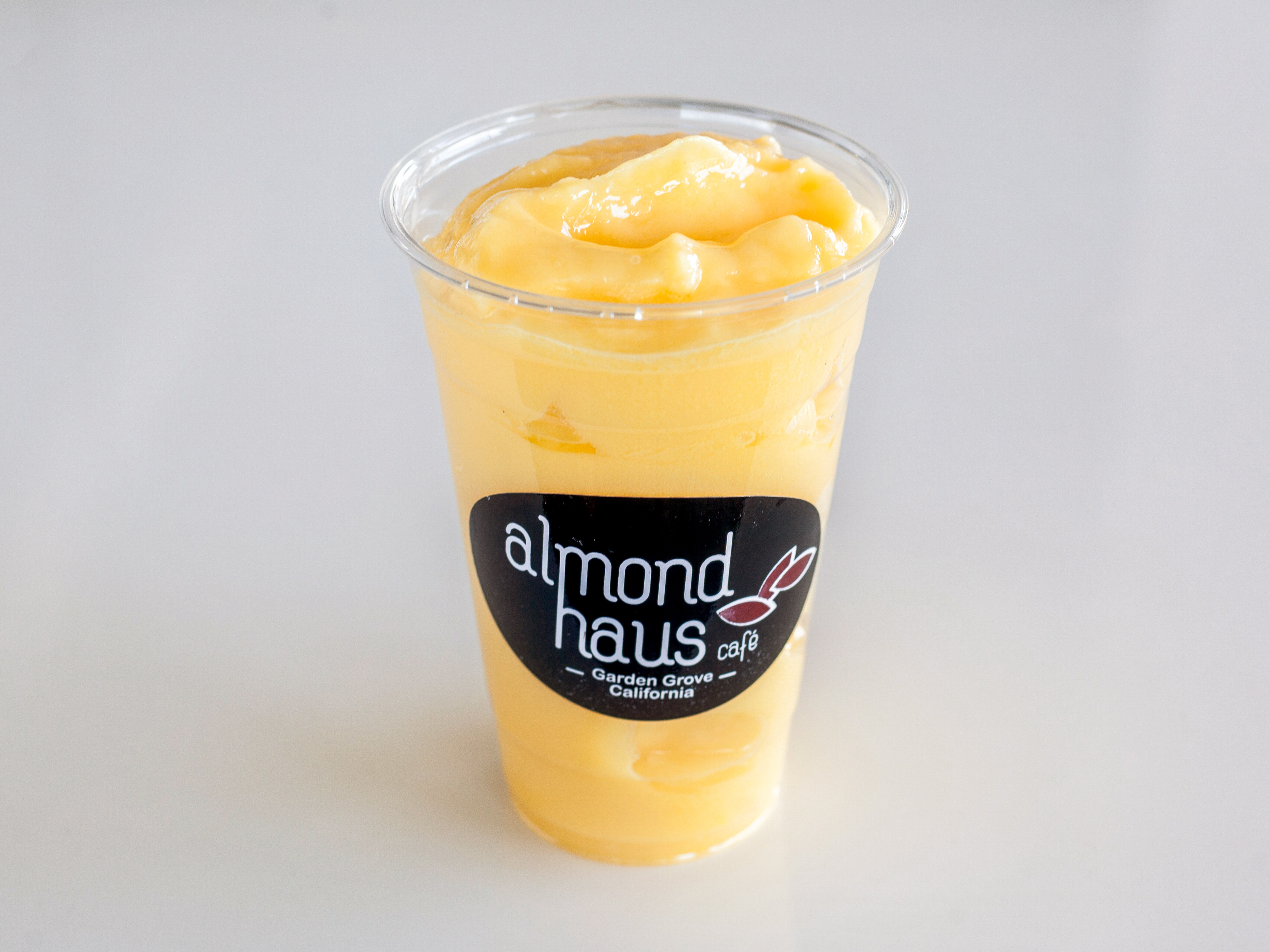 Order Mango Smoothie food online from Almond Haus Cafe store, Garden Grove on bringmethat.com