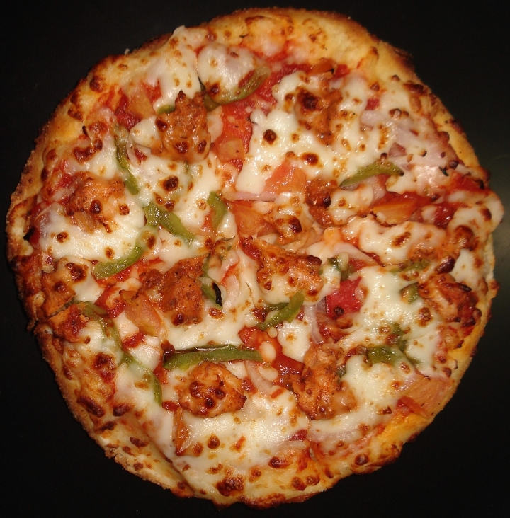 Order Chicken Tikka Pizza food online from Pastries N Chaat store, San Antonio on bringmethat.com