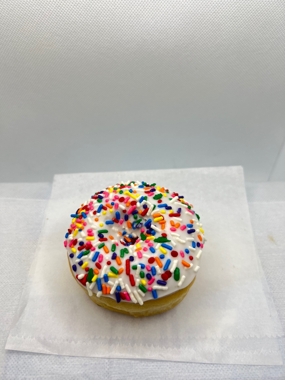 Order White sprinking donut food online from Fresh & Creamy Donuts store, Lewisville on bringmethat.com