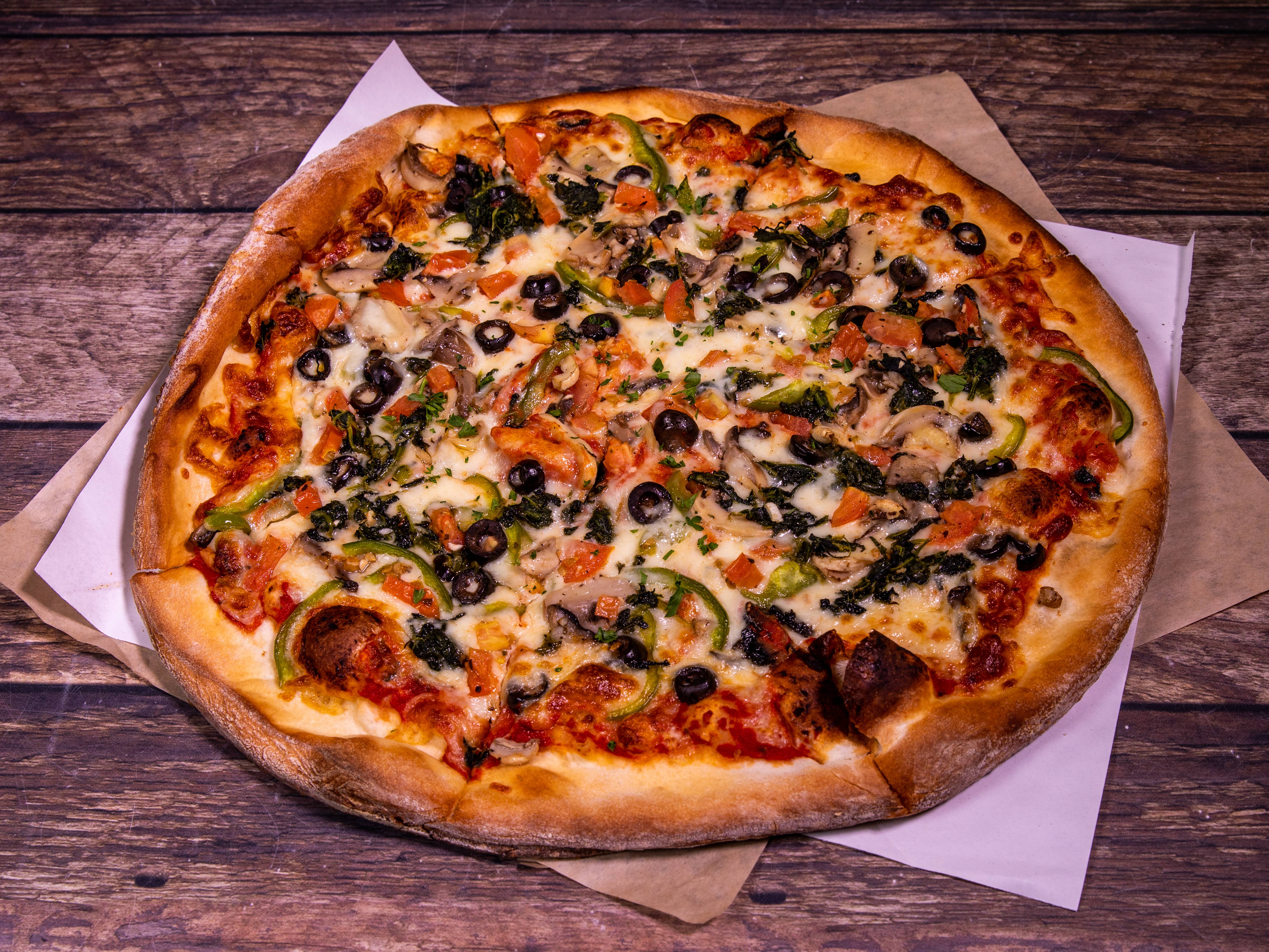 Order Veggie Combo Pizza food online from Italian Cafe store, Irving on bringmethat.com
