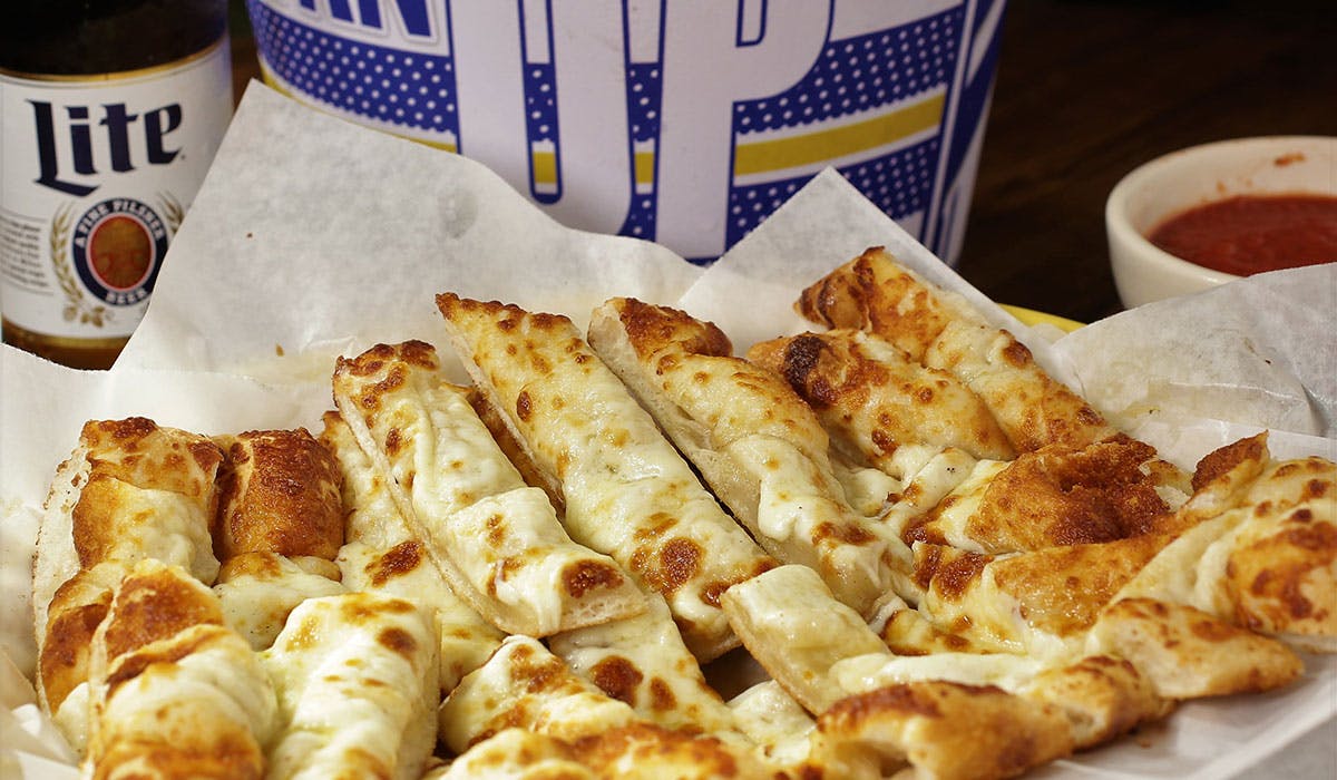 Order Mozzarella Breadsticks - Appetizer food online from Varsity Sports Cafe & Roman Coin Pizza store, Omaha on bringmethat.com