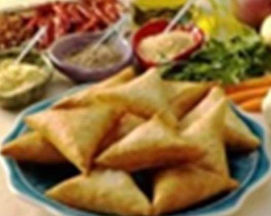 Order Beef Sambusa food online from Almadina Halal store, Norcross on bringmethat.com
