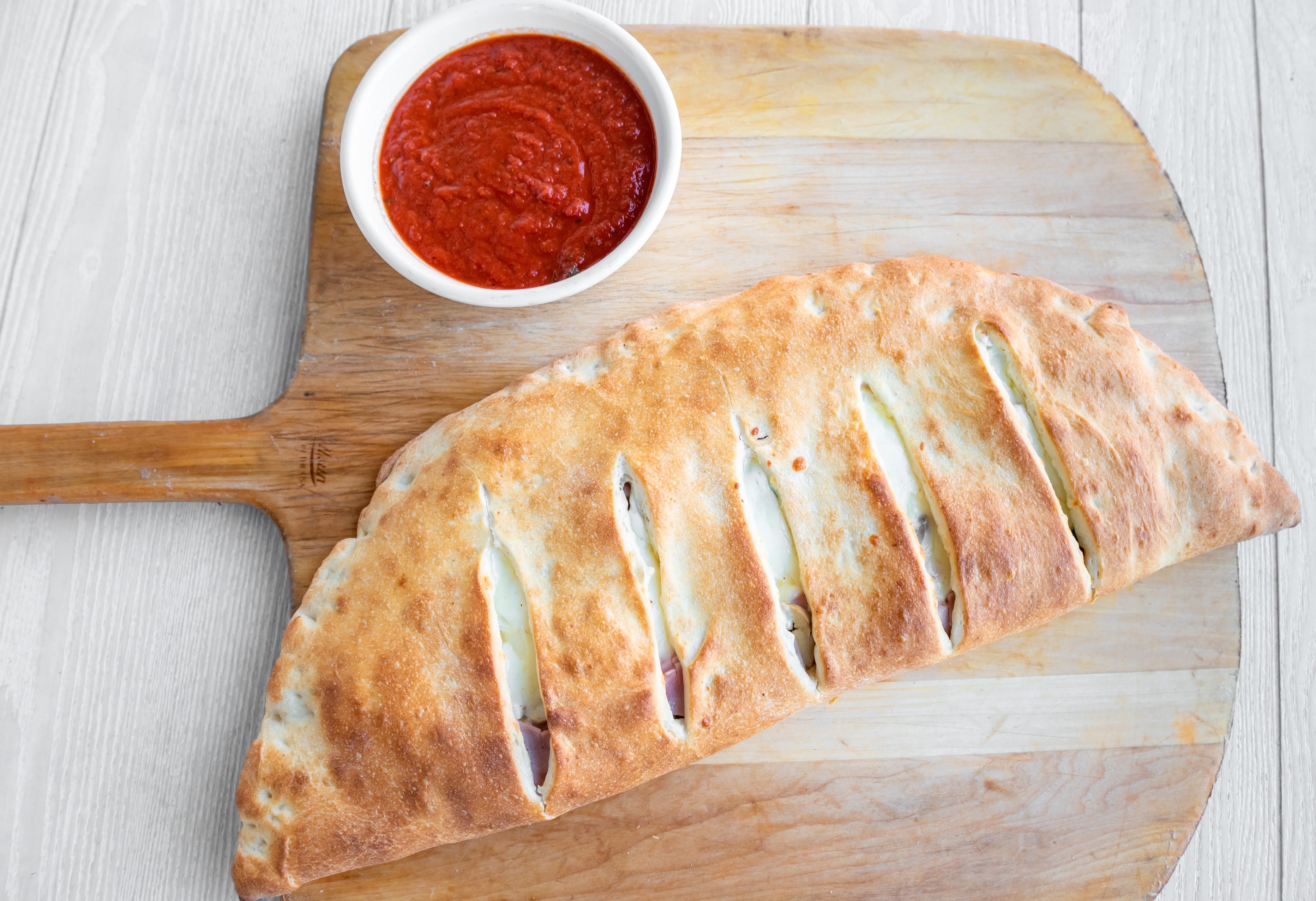 Order Meat Lover Stromboli - Stromboli food online from Arlon's Carry Out store, Baltimore on bringmethat.com