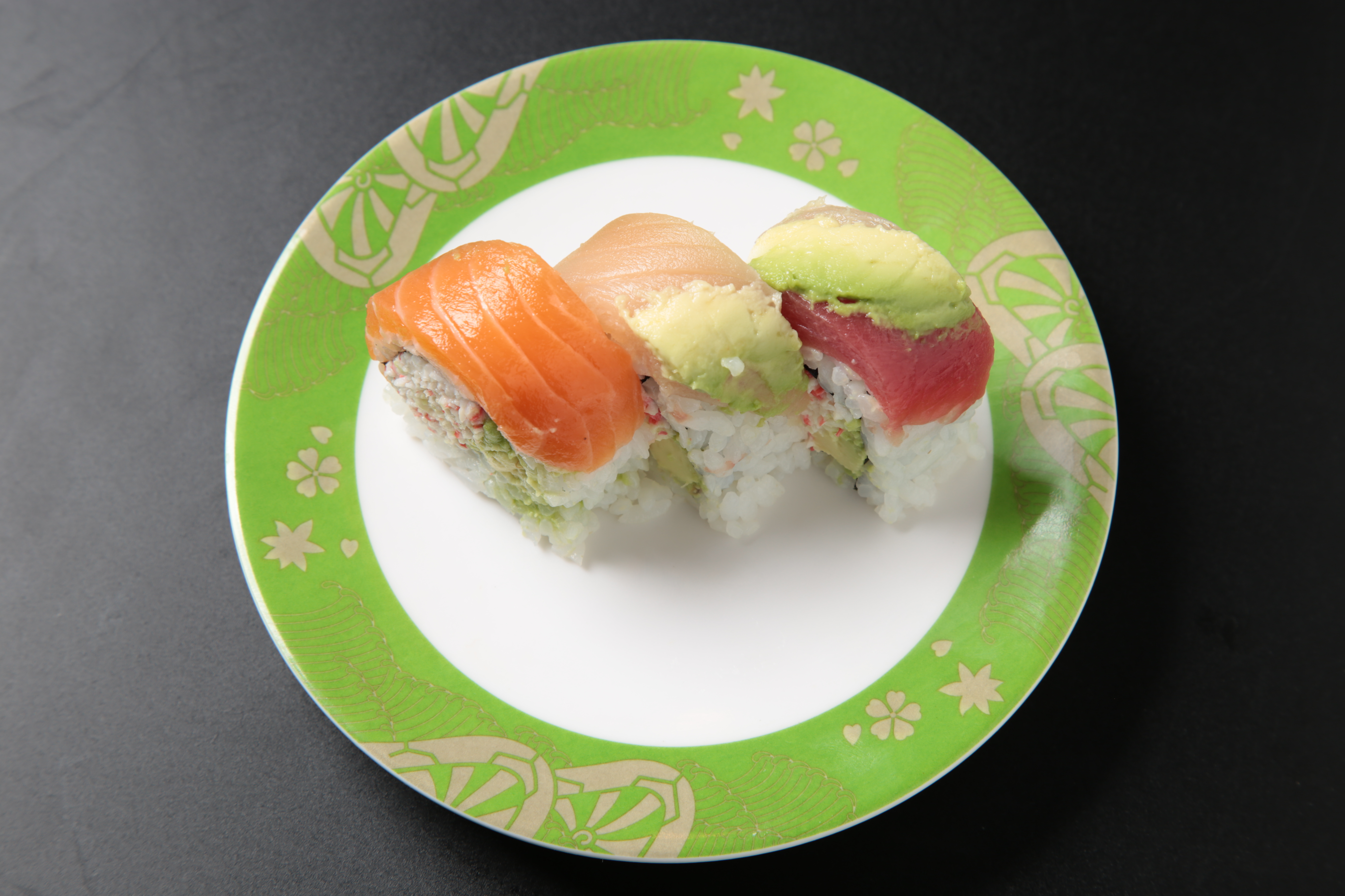 Order Rainbow Roll (9 pcs) food online from Izumi Revolving Sushi store, Daly City on bringmethat.com