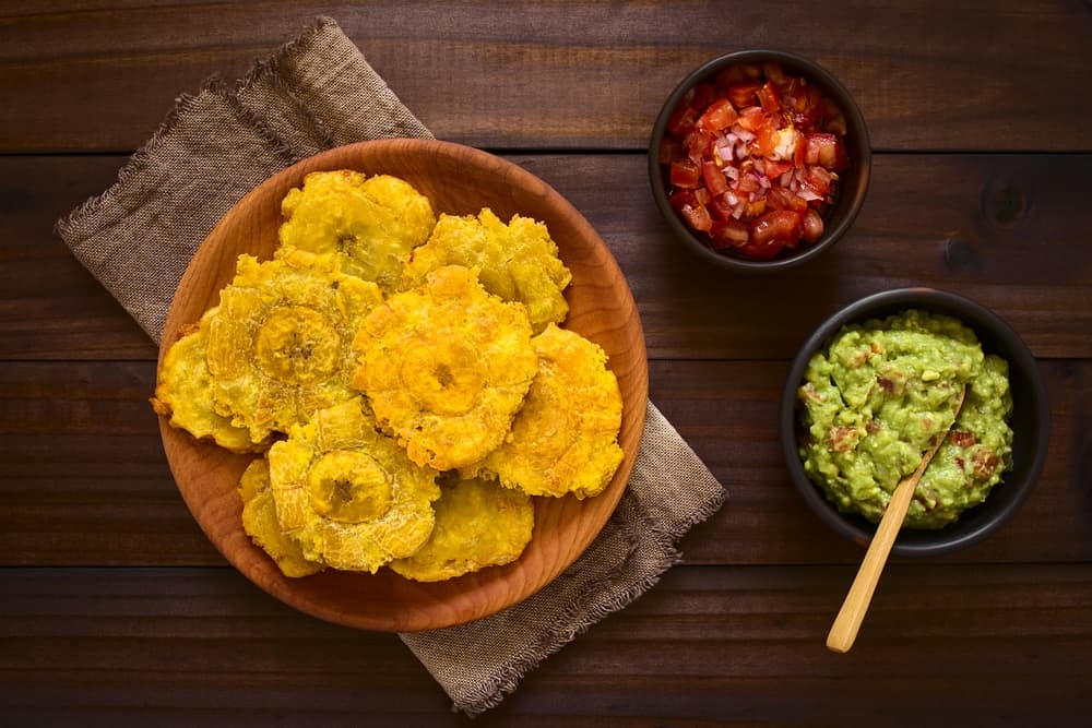 Order Tostones (Plantain Chips) food online from Twisted Taino Restaurant store, Parma on bringmethat.com