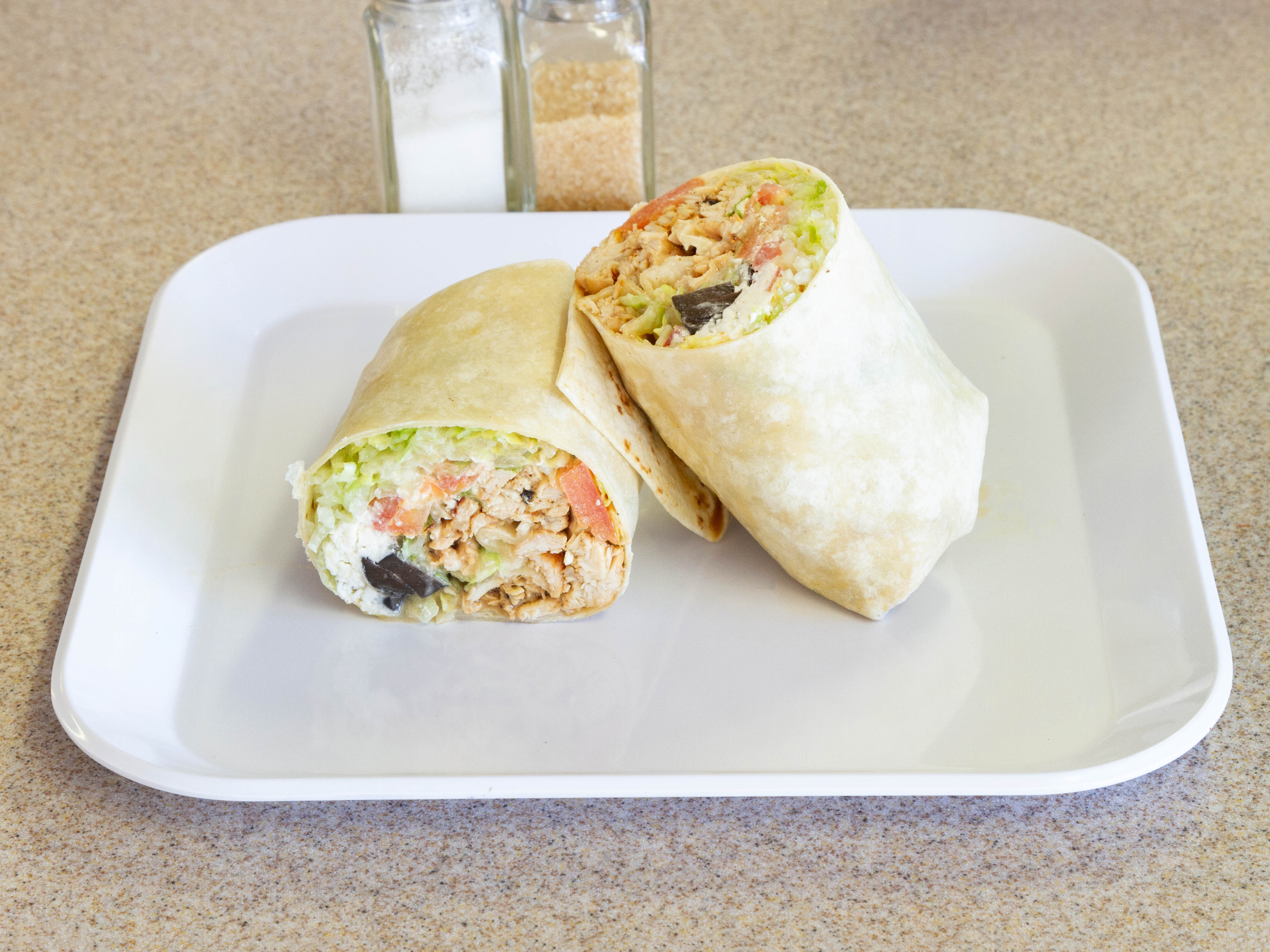 Order Grilled Chicken Caesar Wrap food online from Waltham Pizza store, Waltham on bringmethat.com