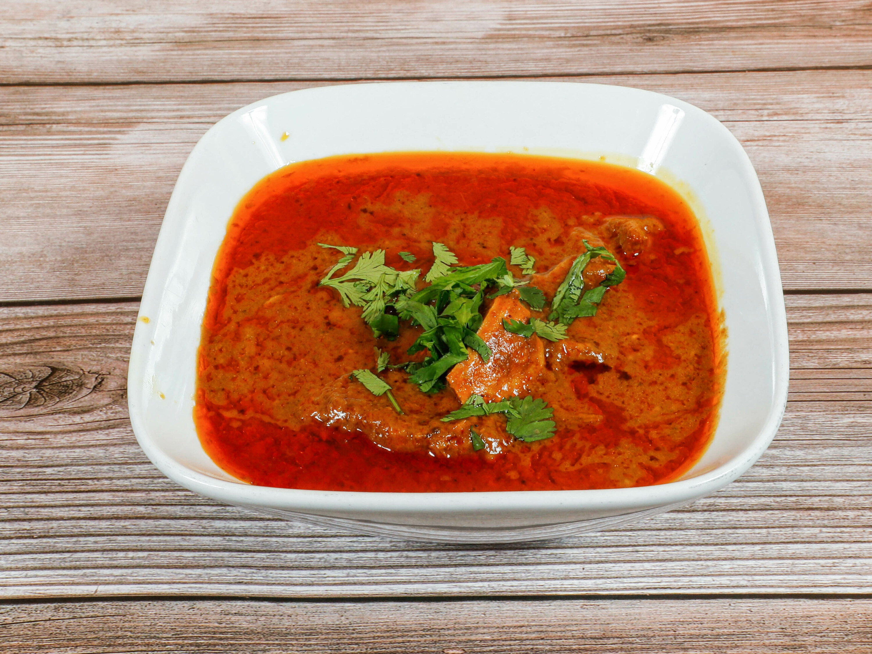 Order Goat Curry  food online from Kabana store, Berkeley on bringmethat.com
