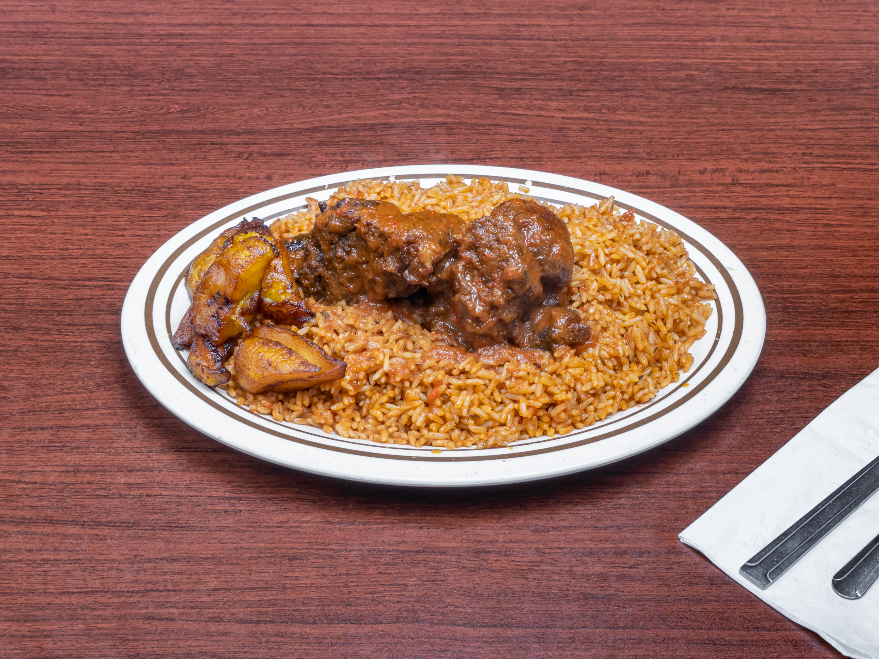 Order Jollof Rice with Chicken food online from Marie African Restaurant store, Houston on bringmethat.com