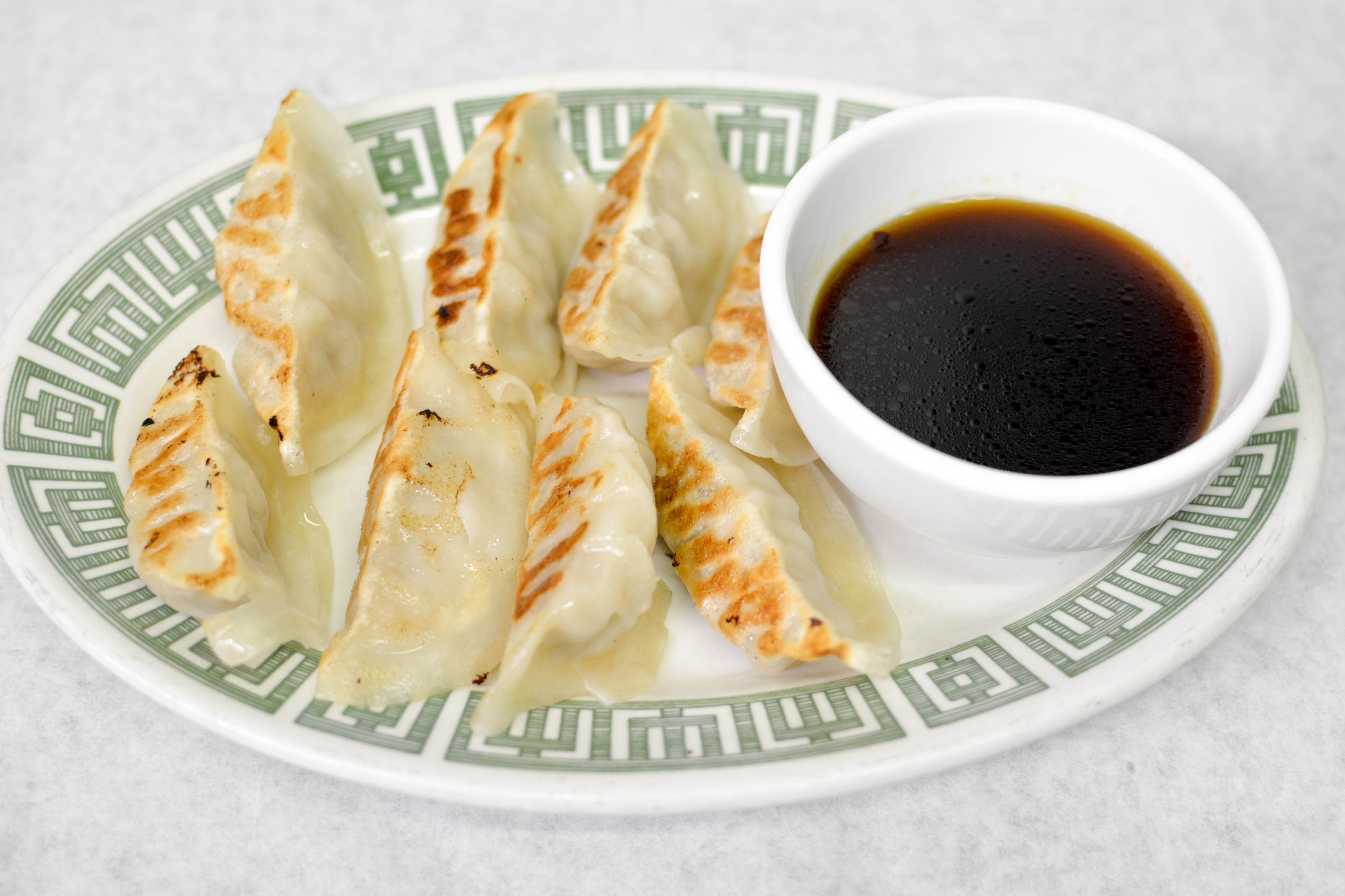 Order 8 Piece Potstickers 锅贴 food online from Jade Palace store, Louisville on bringmethat.com