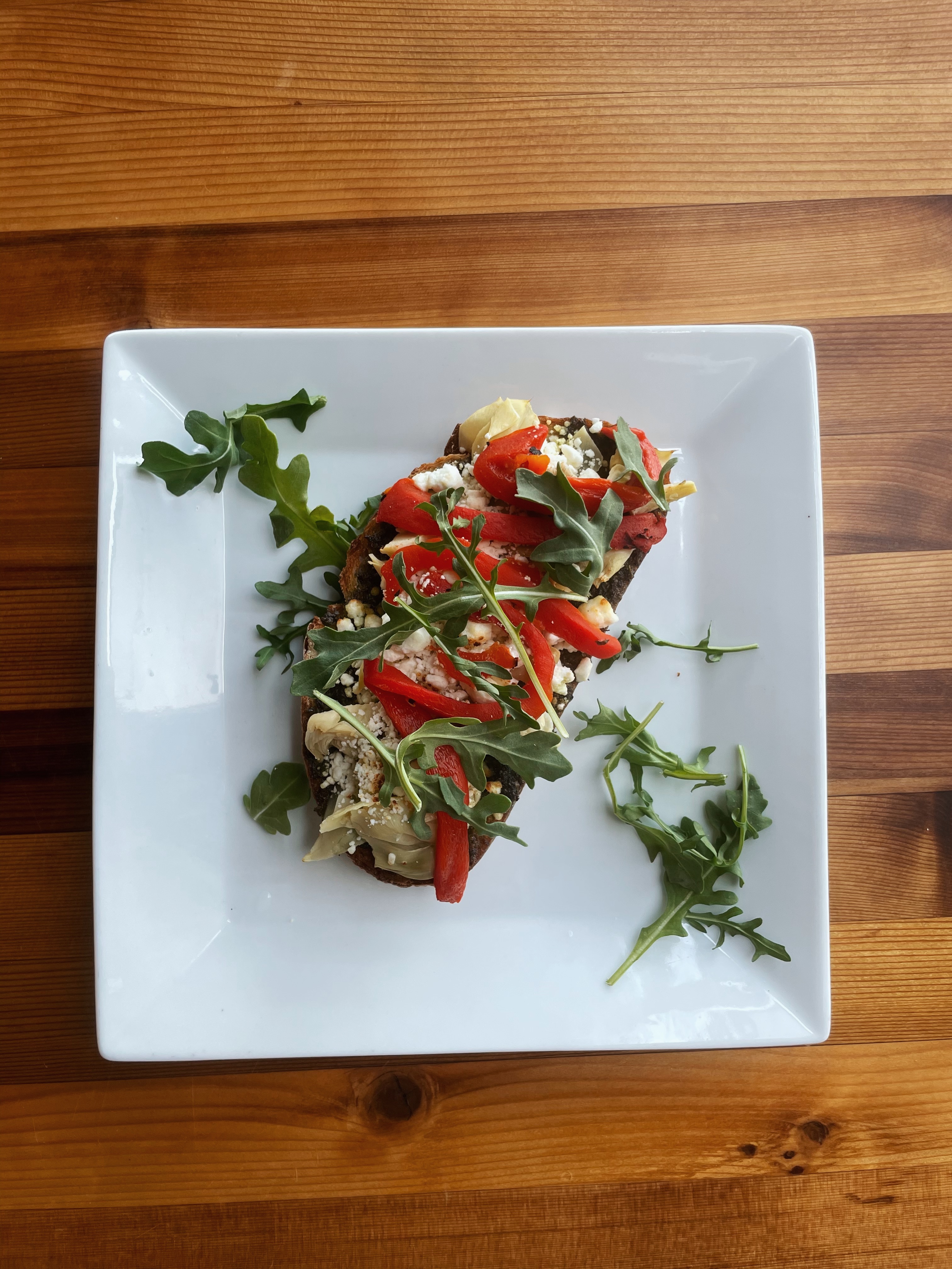 Order Pesto, Artichoke, Roasted Red Peppers, Feta and Arugula Toast food online from Hob Coffee San Marcos store, San Marcos on bringmethat.com