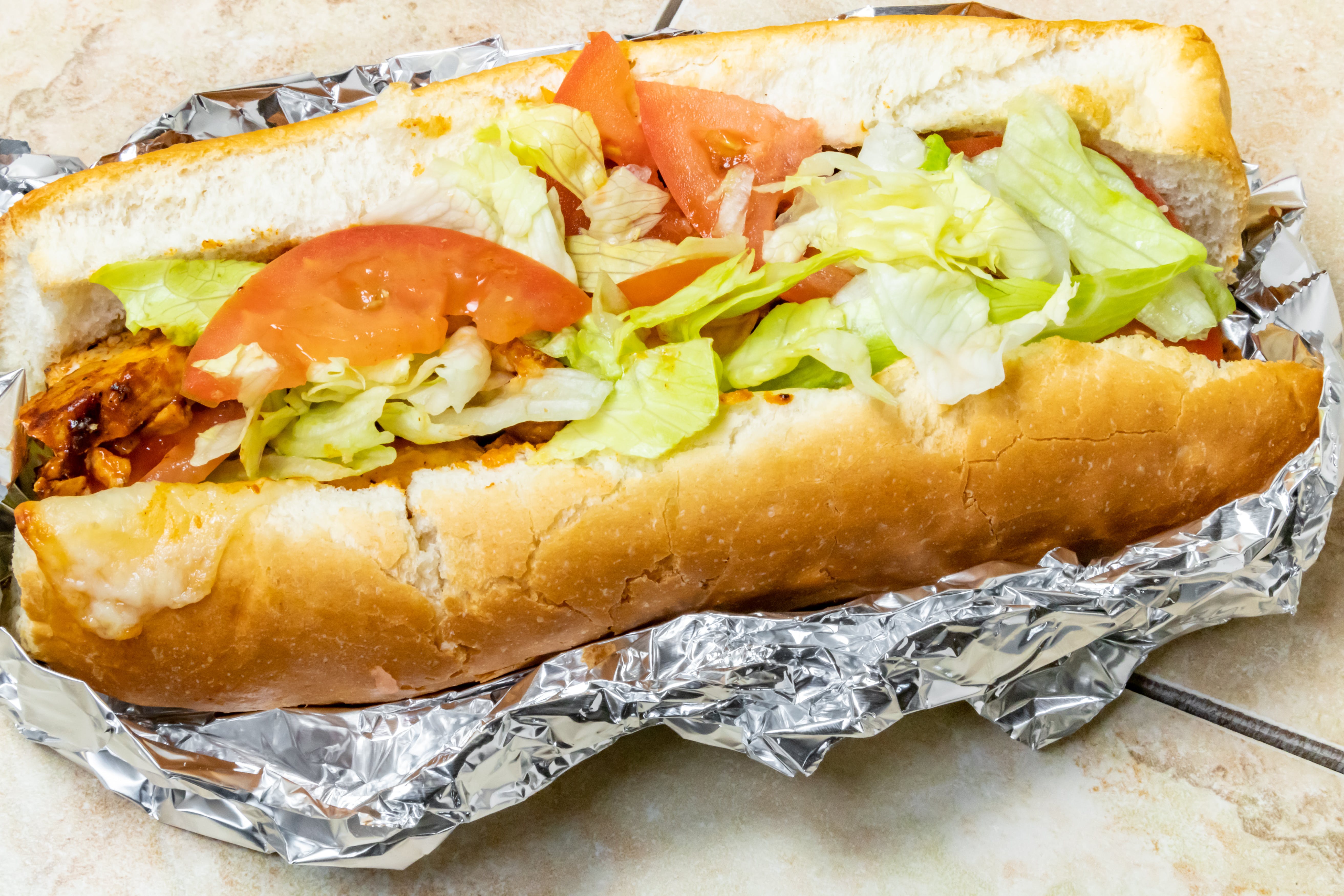 Order Grilled Chicken Sub - Sub food online from Novotny's Groceries & Pizza store, Worthington on bringmethat.com